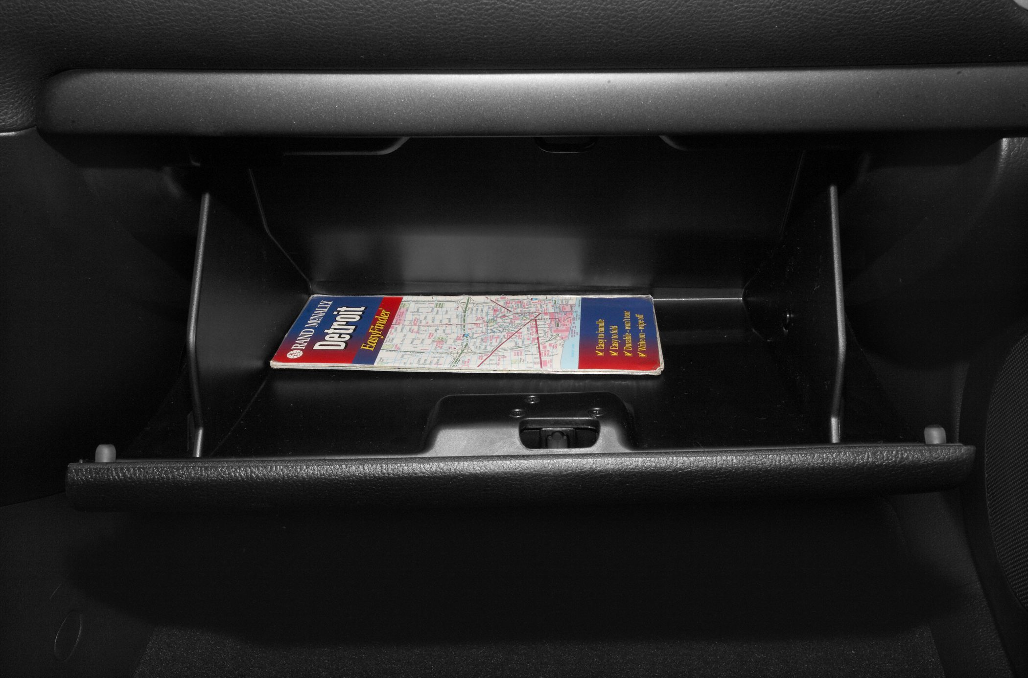 Open glove compartment with map inside