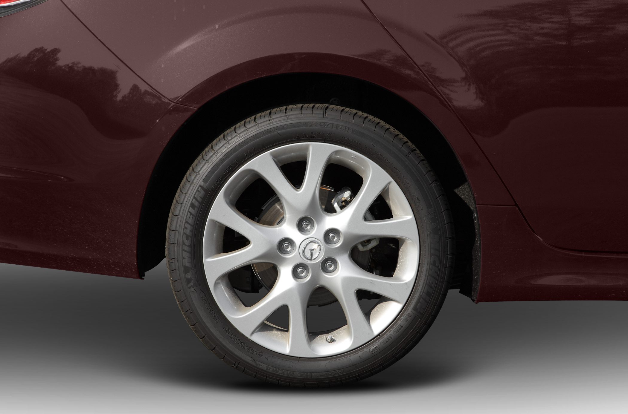 Close-up of alloy wheel and tire on rear quarter panel