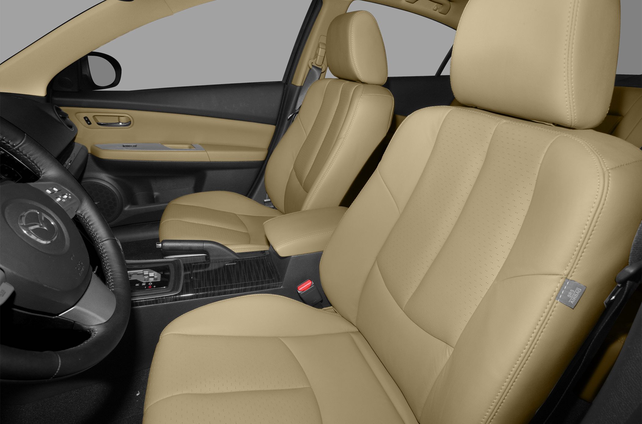 Beige leather front seats and center console with armrest.