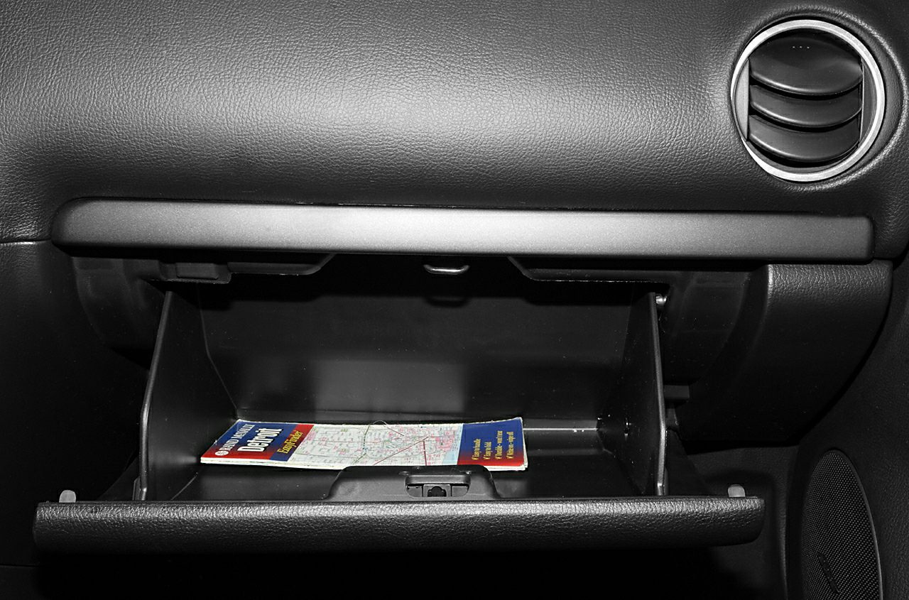 Open glove compartment with interior car storage space