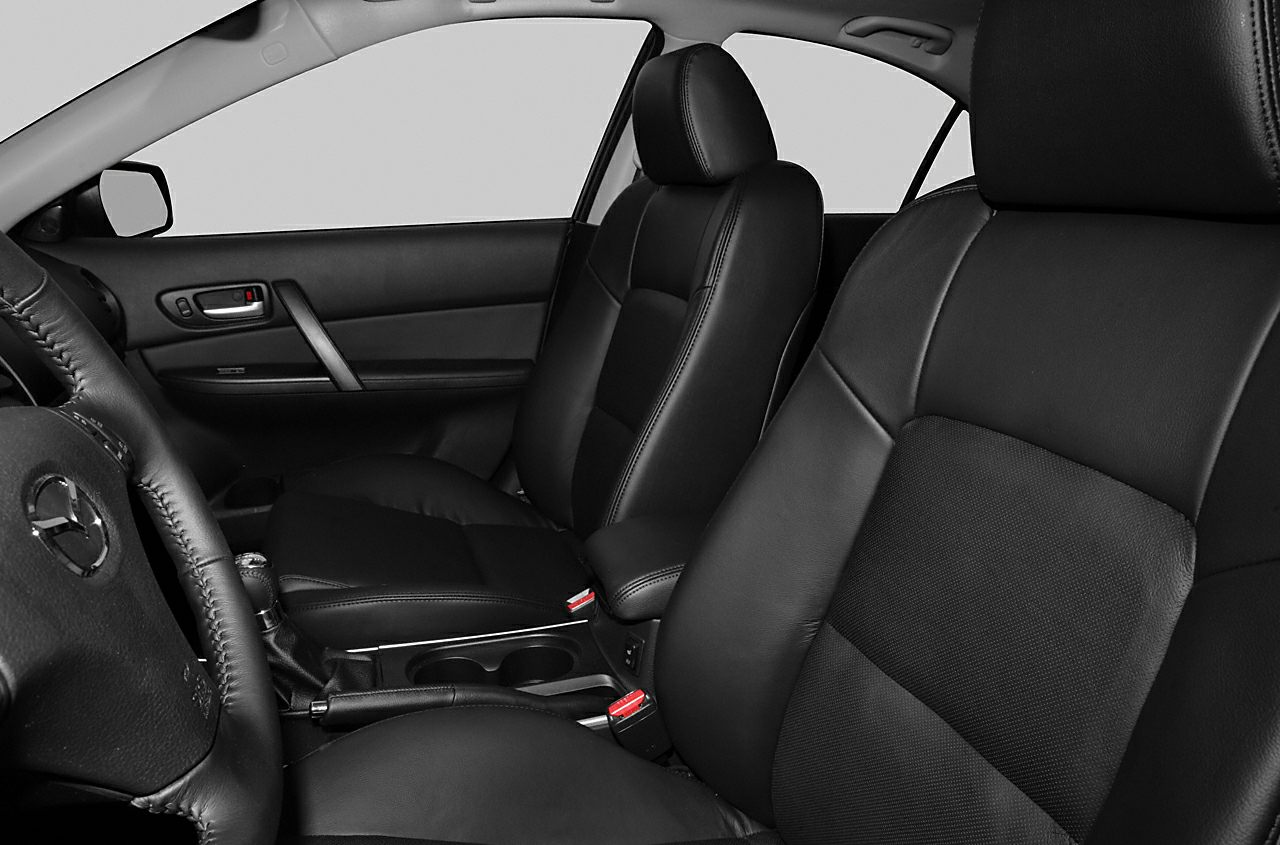 Black leather front seats and center console cabin interior