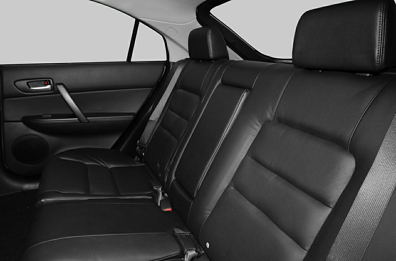 Black leather rear seats with seat belts and door panel