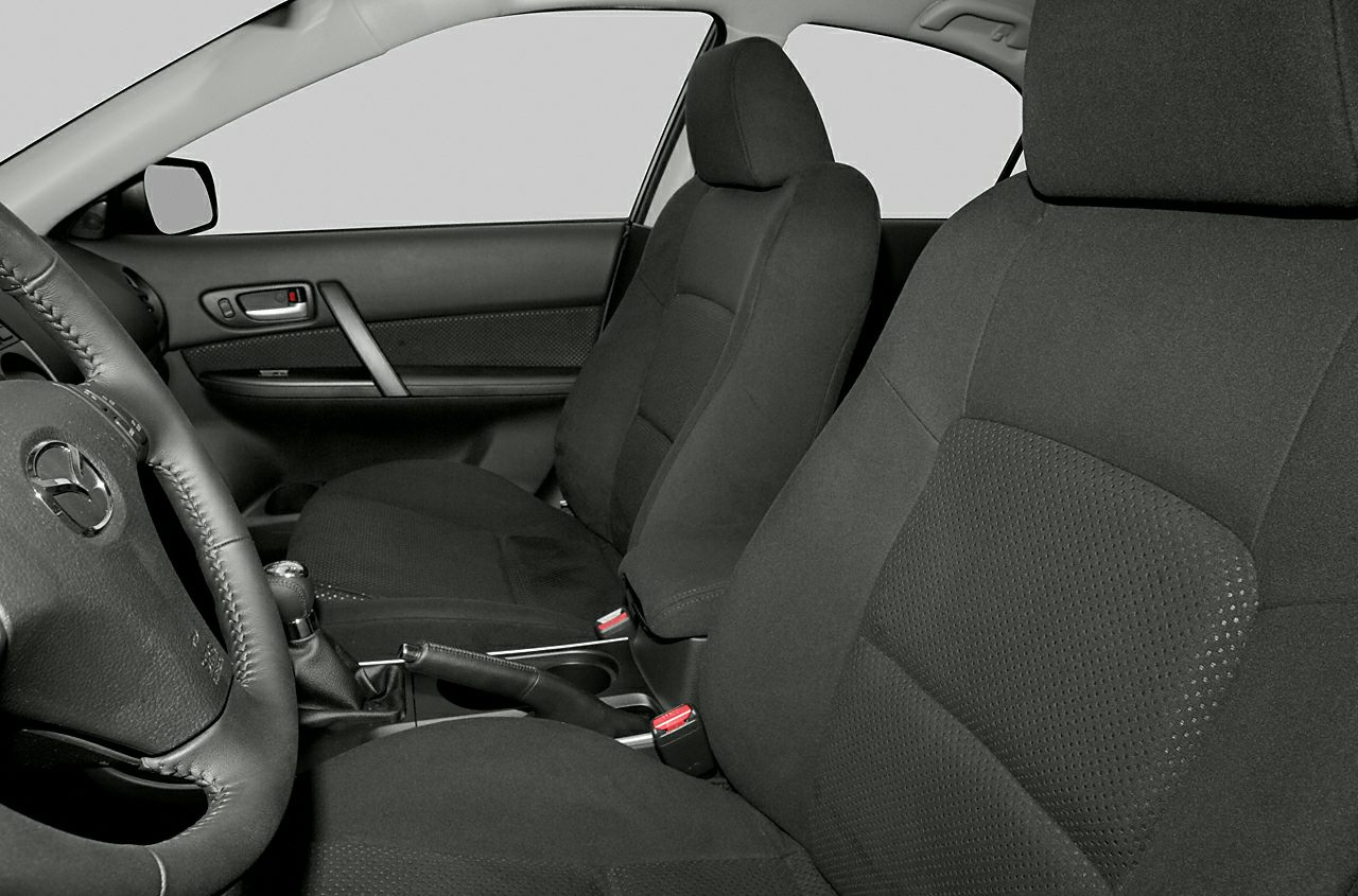 Front cloth seats and door panel with control elements.