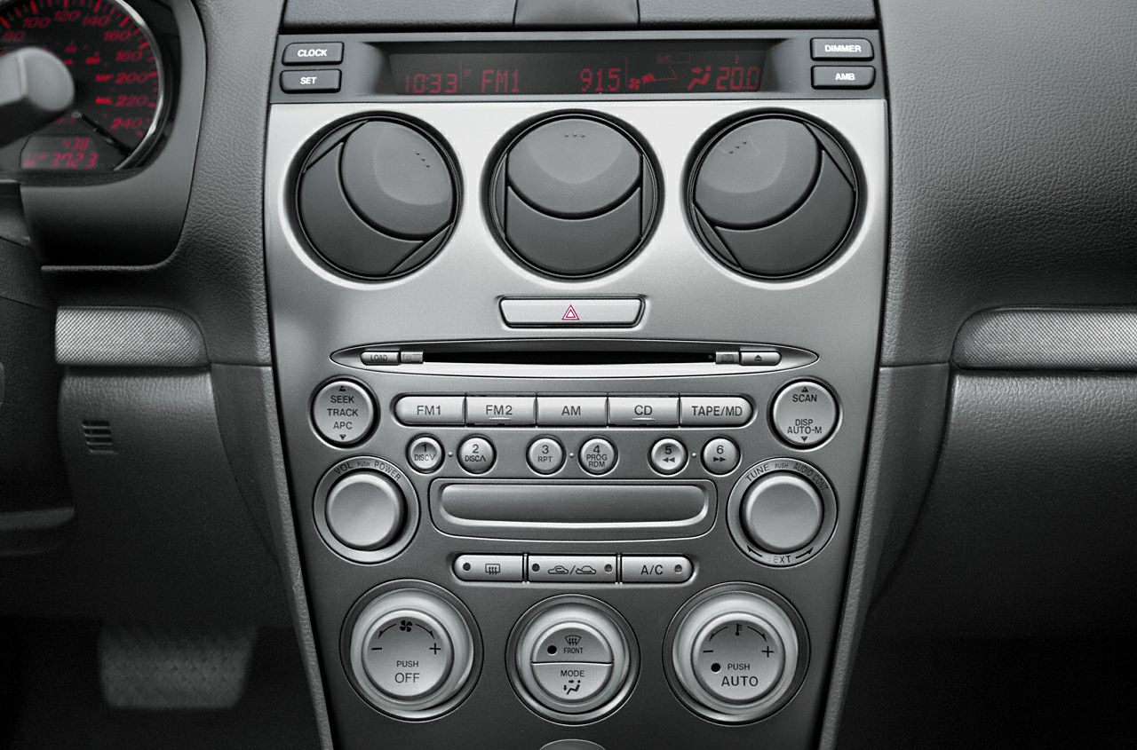 Center console with climate controls and multi-function radio system