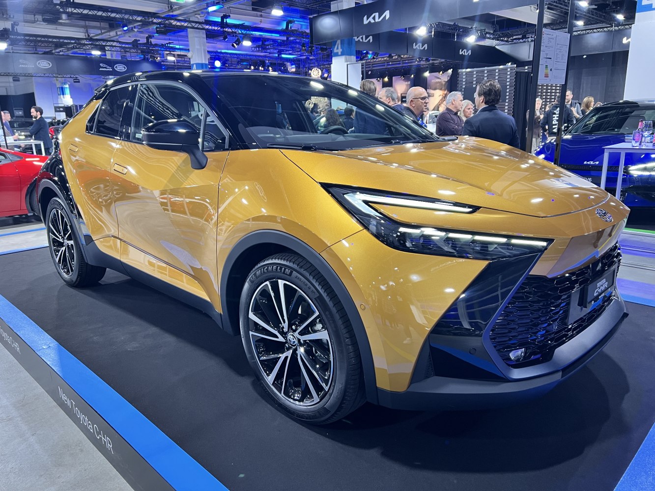 Sleek front and side profile with LED headlights and two-tone gold and black paint.