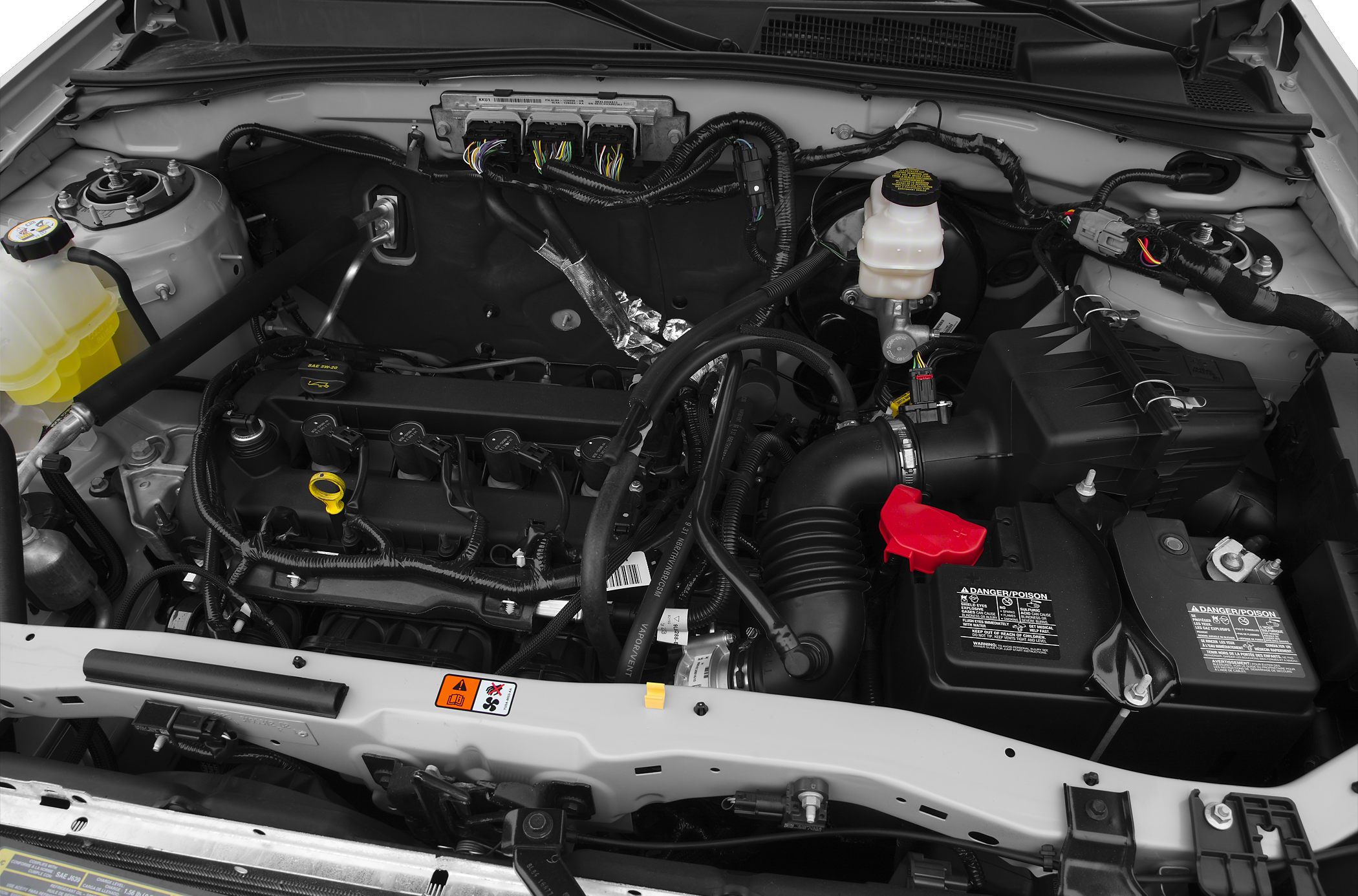 Engine bay with engine block, battery, and wiring