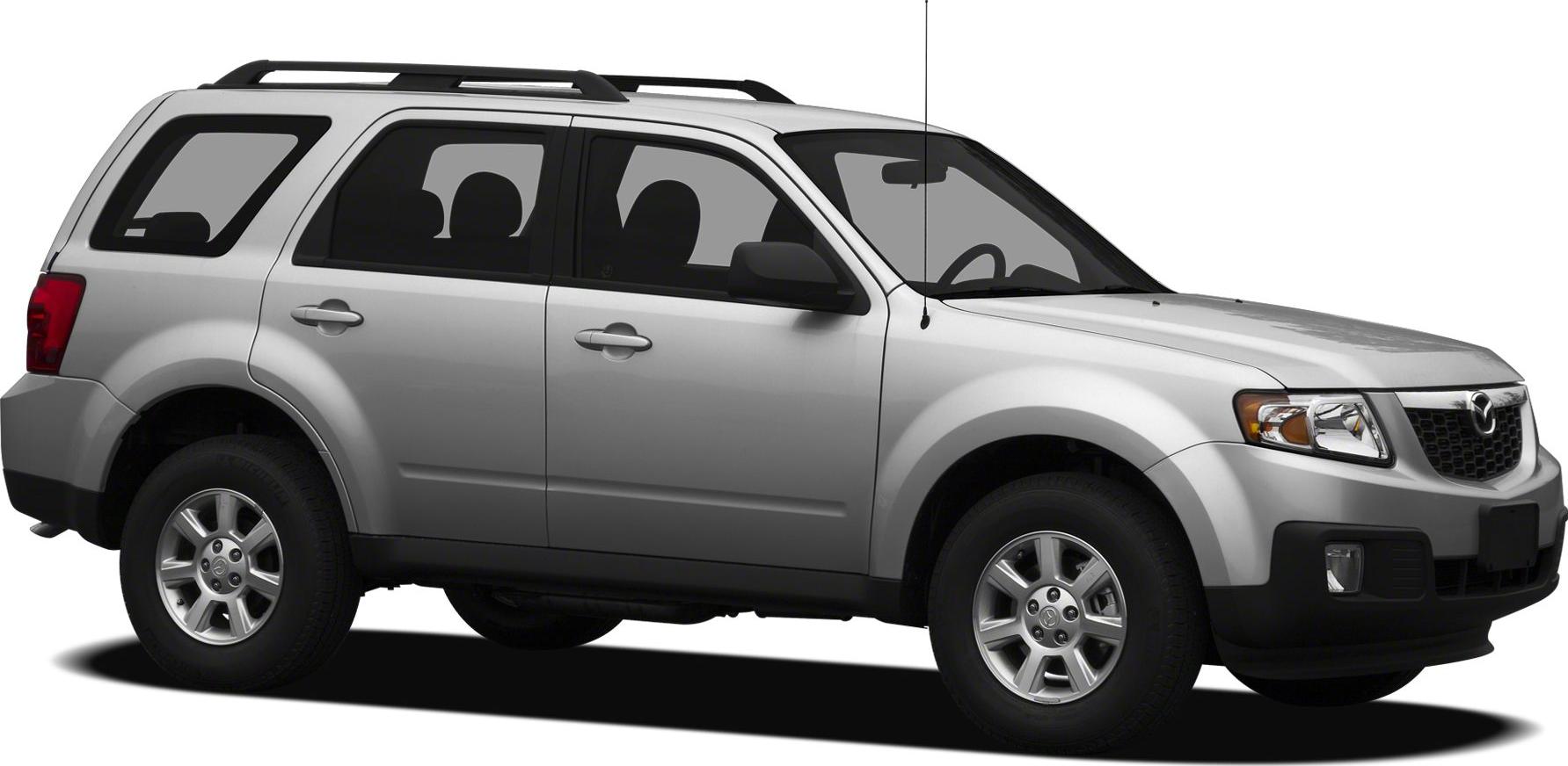 Silver SUV with roof rack and alloy wheels side profile.