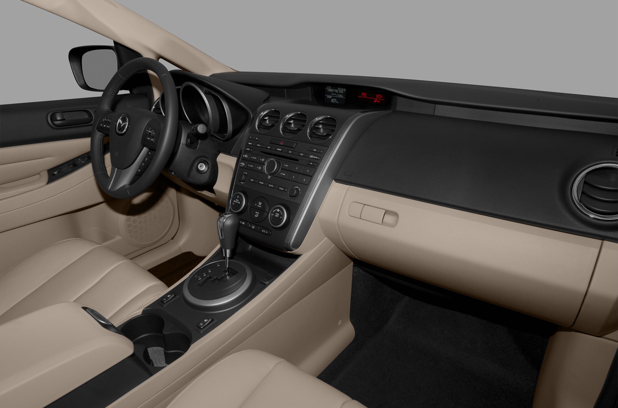 Dashboard, center console, steering wheel, beige leather seats interior