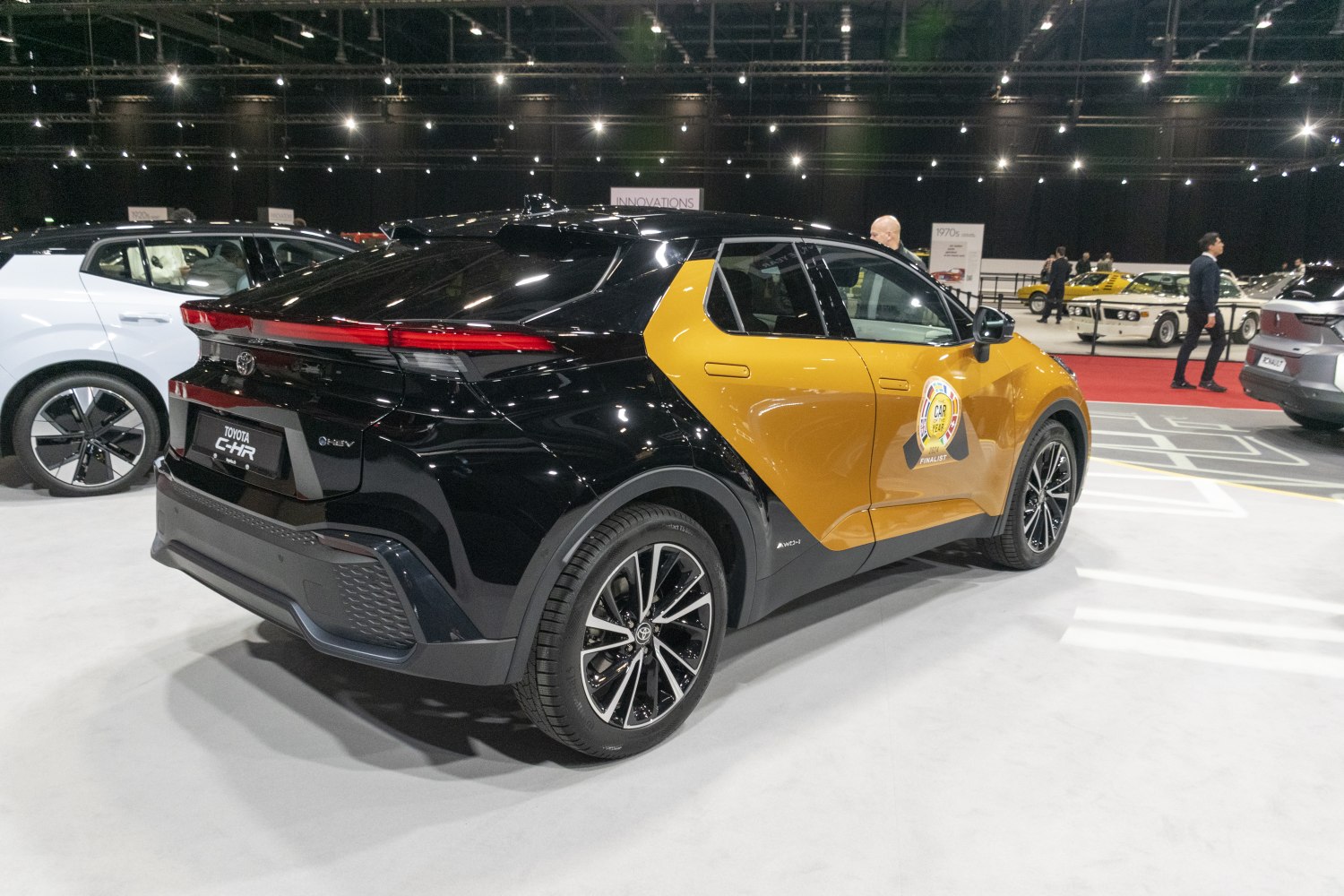 Black and gold two-tone compact SUV with sporty rear LED light strip and stylish wheels
