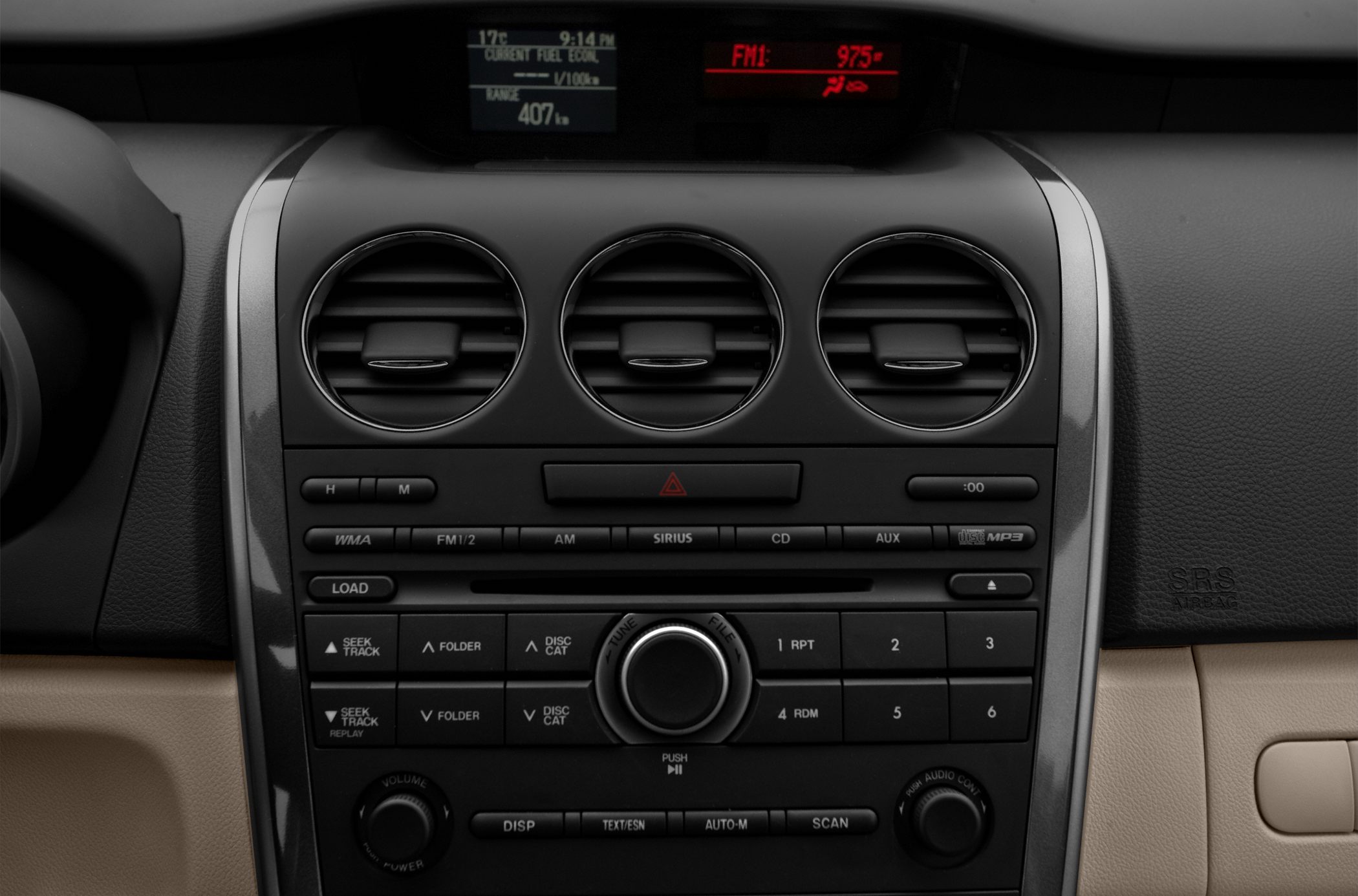 Close-up of car air vents and audio control panel