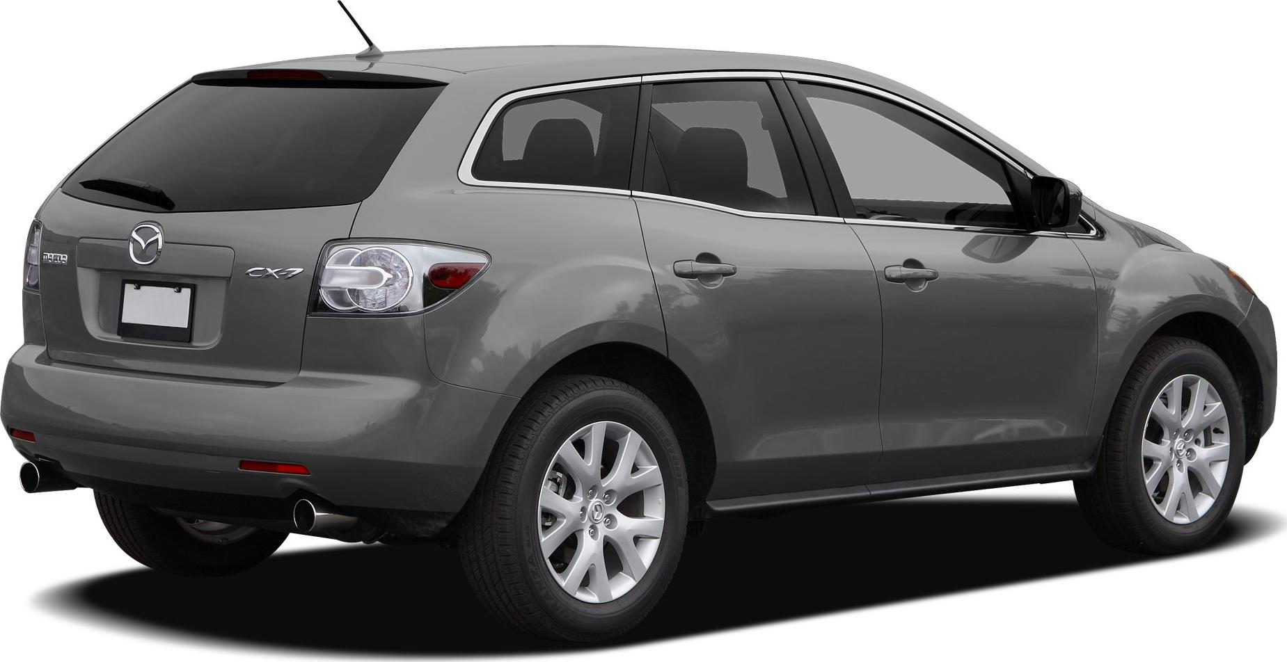 Rear side view with dual exhaust and alloy wheels