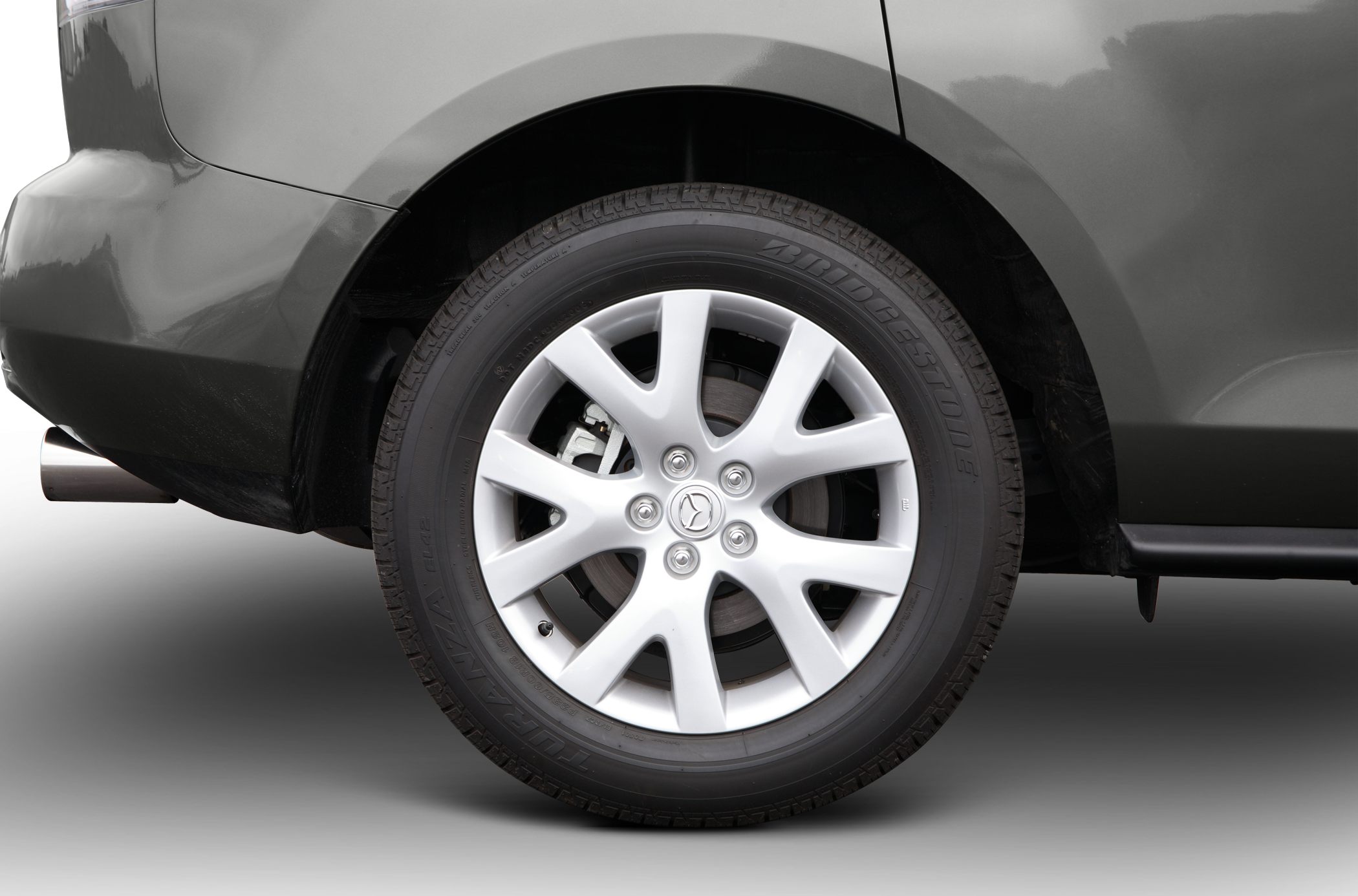 Close-up of alloy wheel with Bridgestone tire on SUV rear side