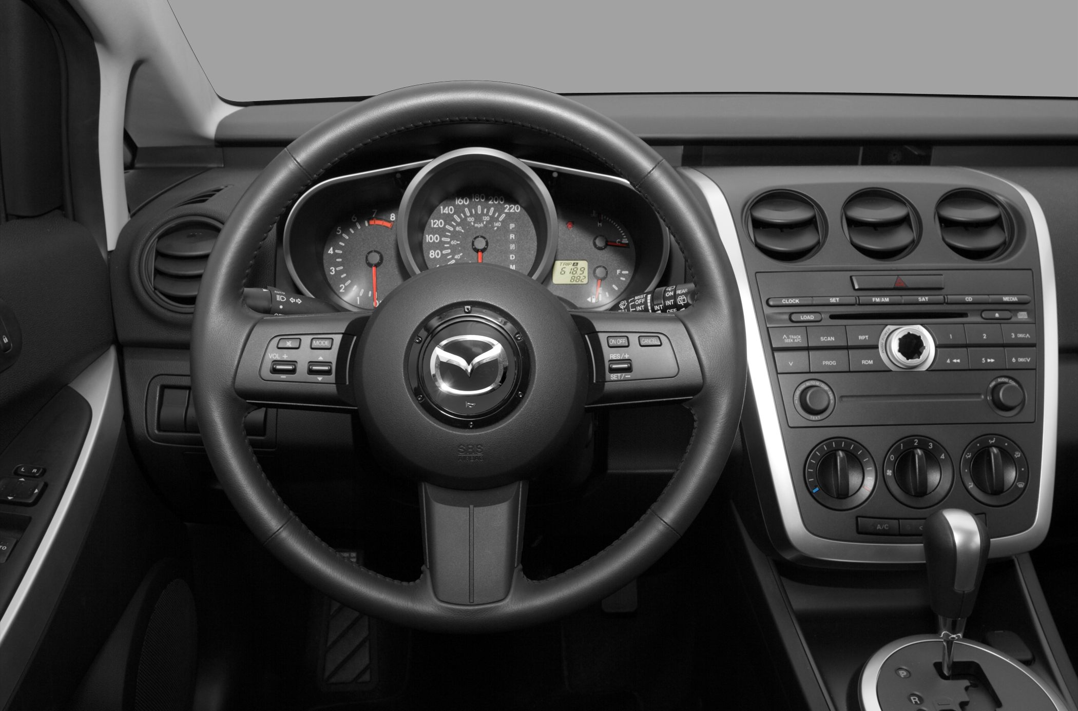 Steering wheel, instrument cluster, and center console with controls