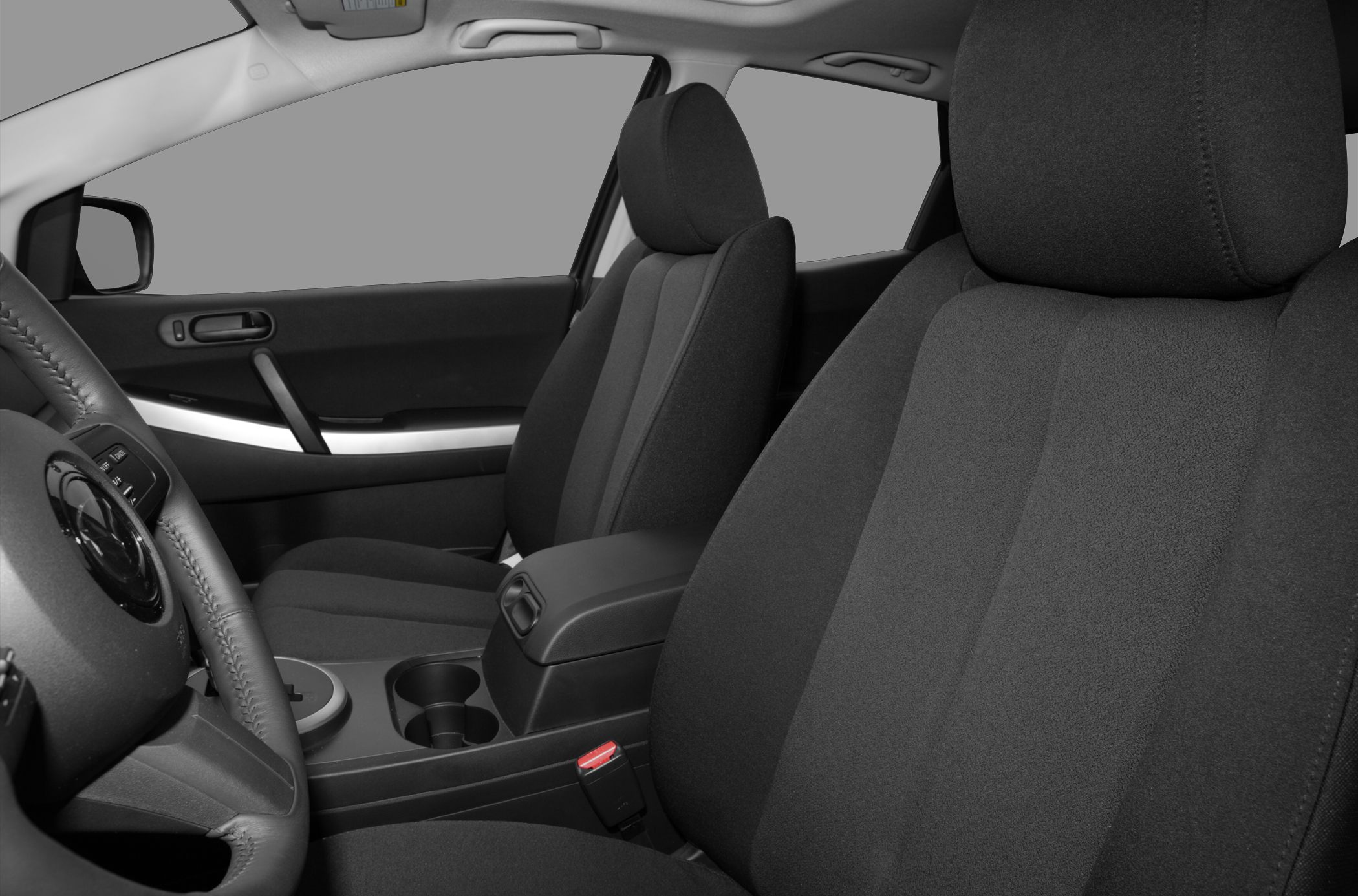 Front fabric seats, center console, and door panel of car interior