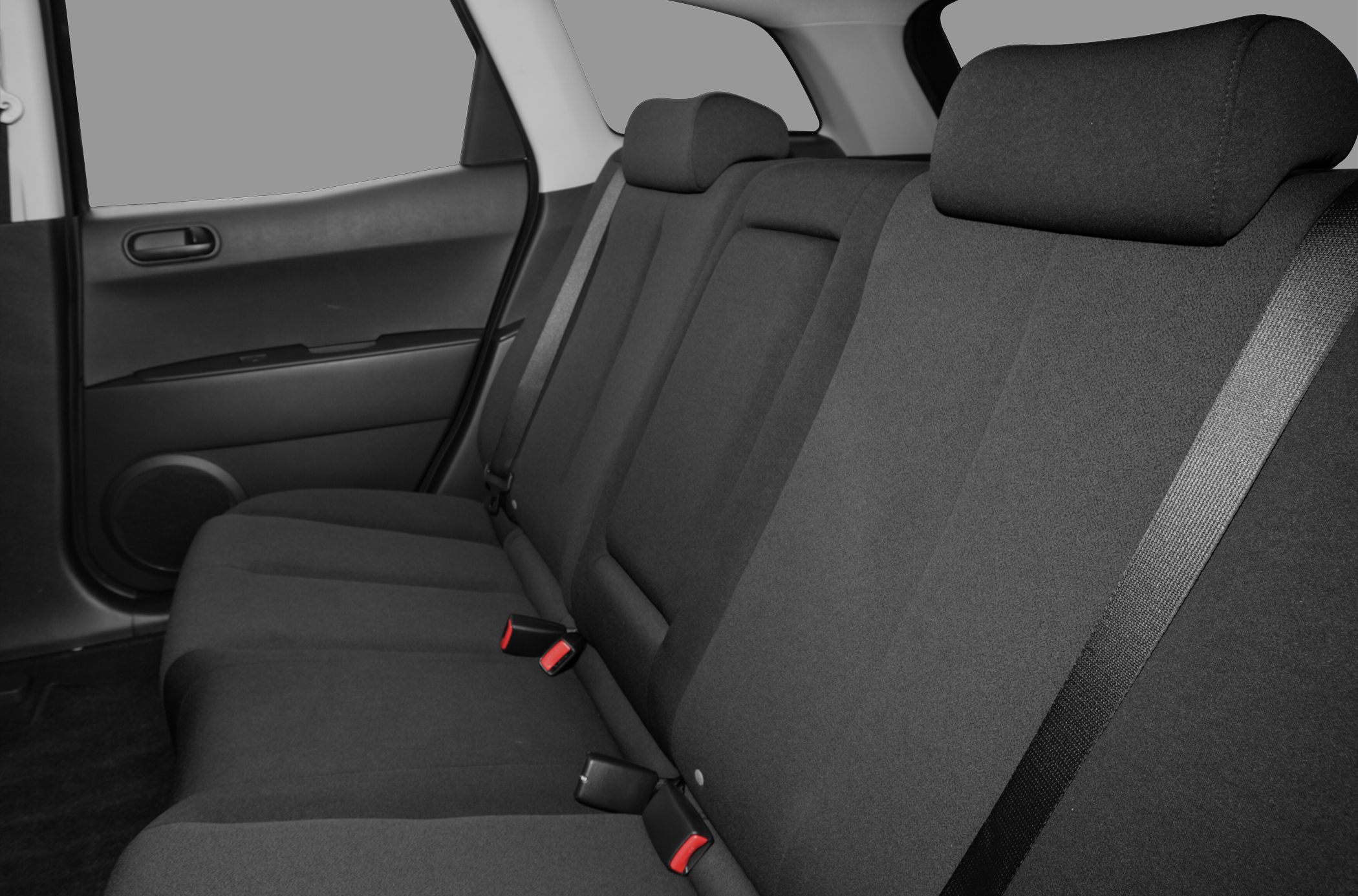 Spacious rear seat with fabric upholstery and seat belts