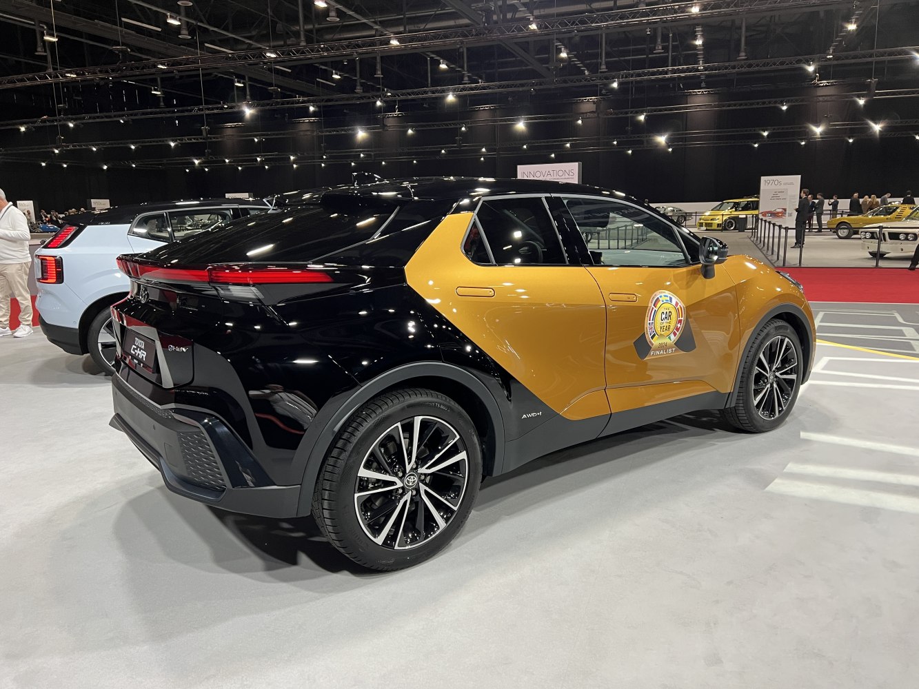 Two-tone paintwork with AWD badge and alloy wheels from rear side view