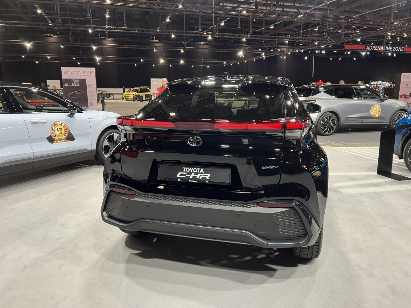 Rear view with sleek tail lights and hybrid badge