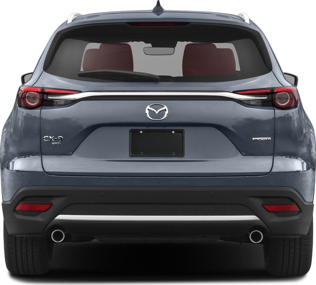 Rear view of SUV with dual exhausts, AWD and Skyactiv badges