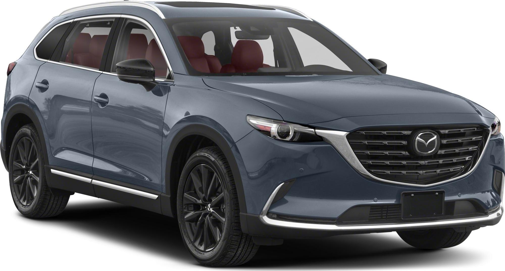 Front grille and side profile with black wheels and red interior seats