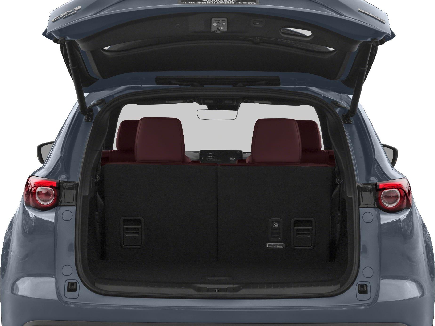 Open rear cargo area with upright rear seats and tailgate open