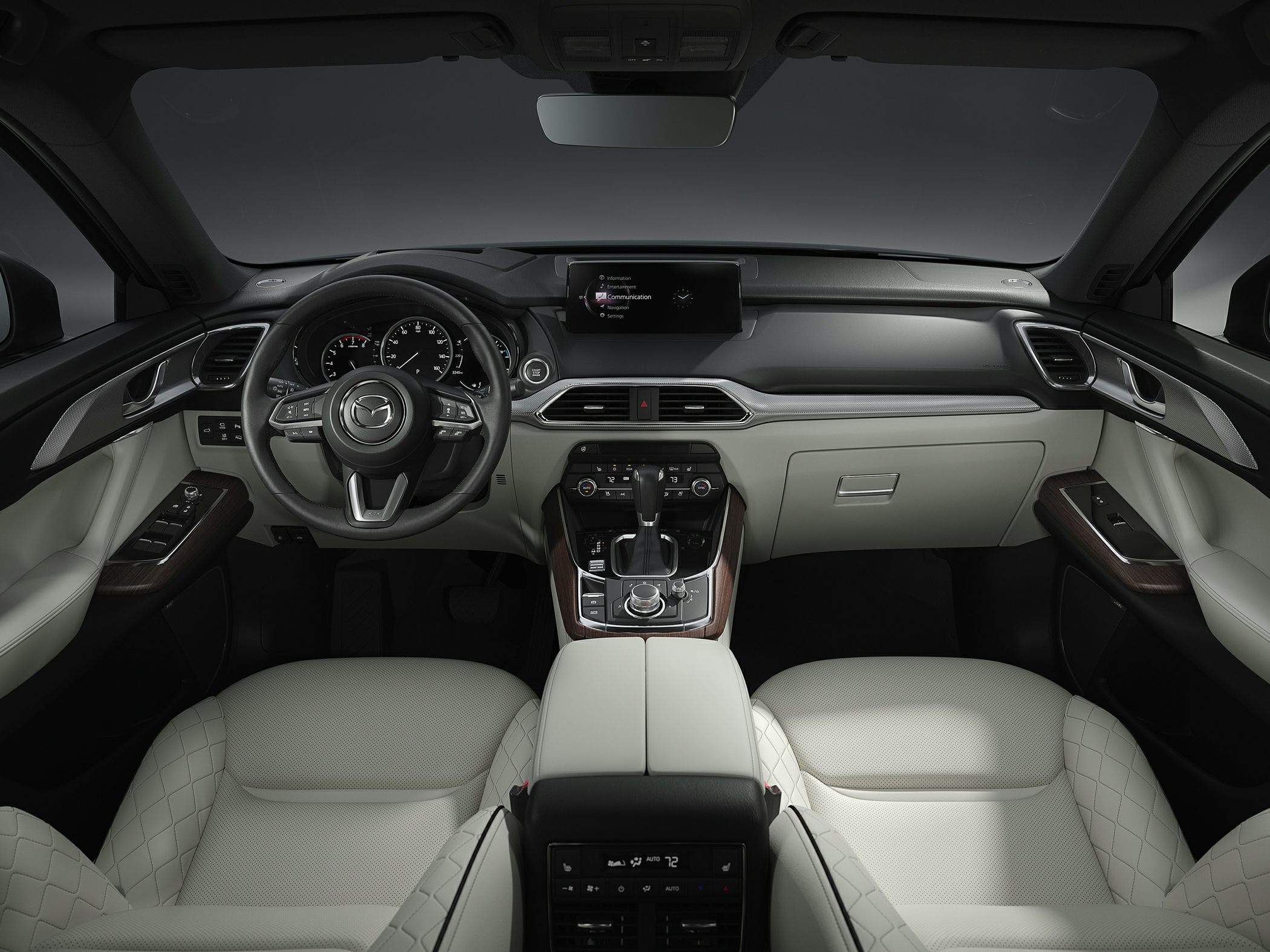 Luxury SUV interior with dashboard, steering wheel, and infotainment system