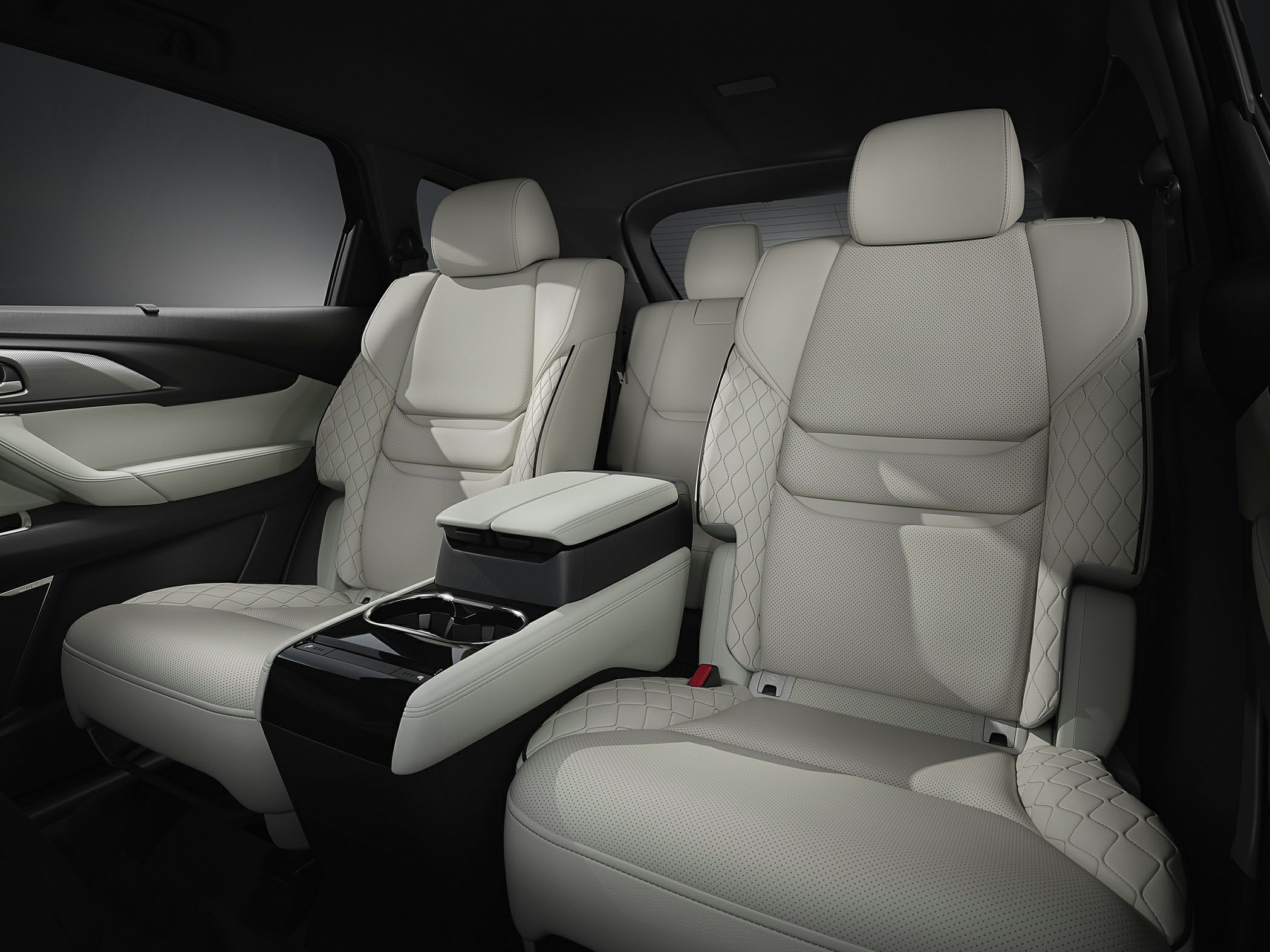 Premium rear seats with quilted design and center armrest with cupholders