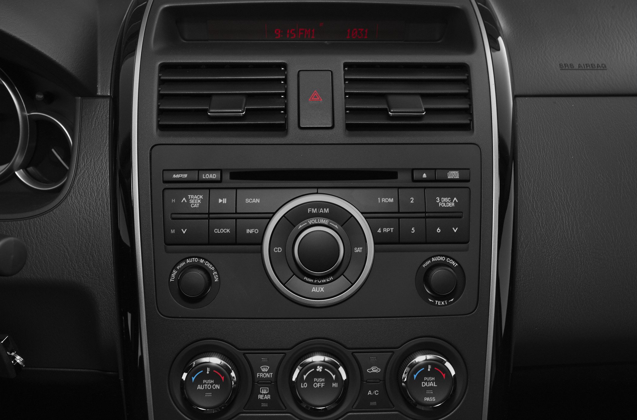 Close-up of dashboard audio system and climate control dials