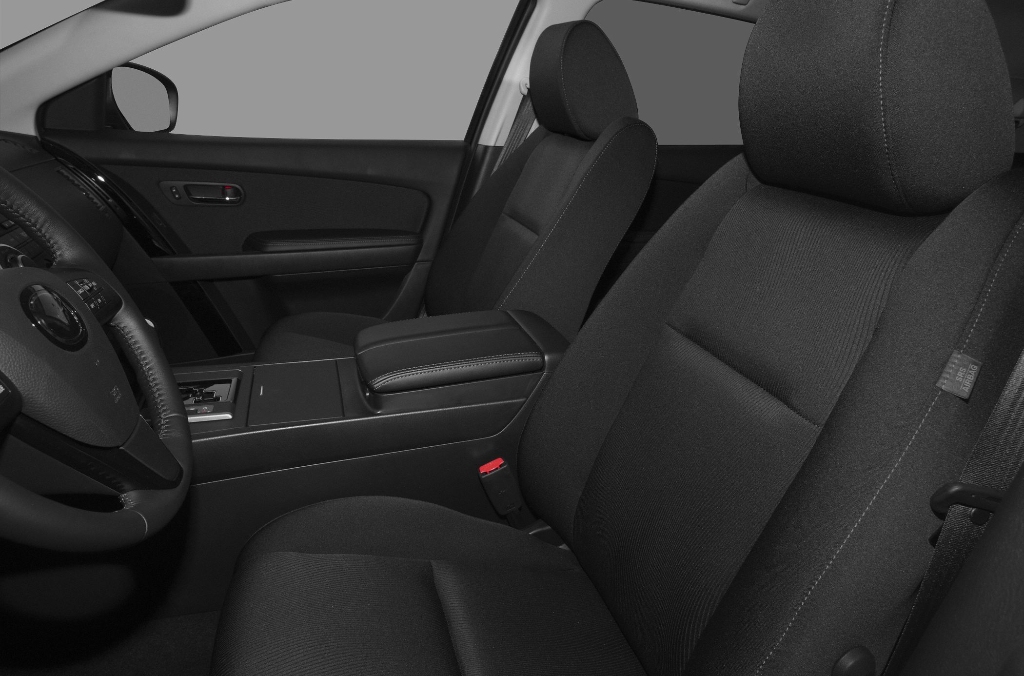 Front seats, center console, and armrest with fabric upholstery