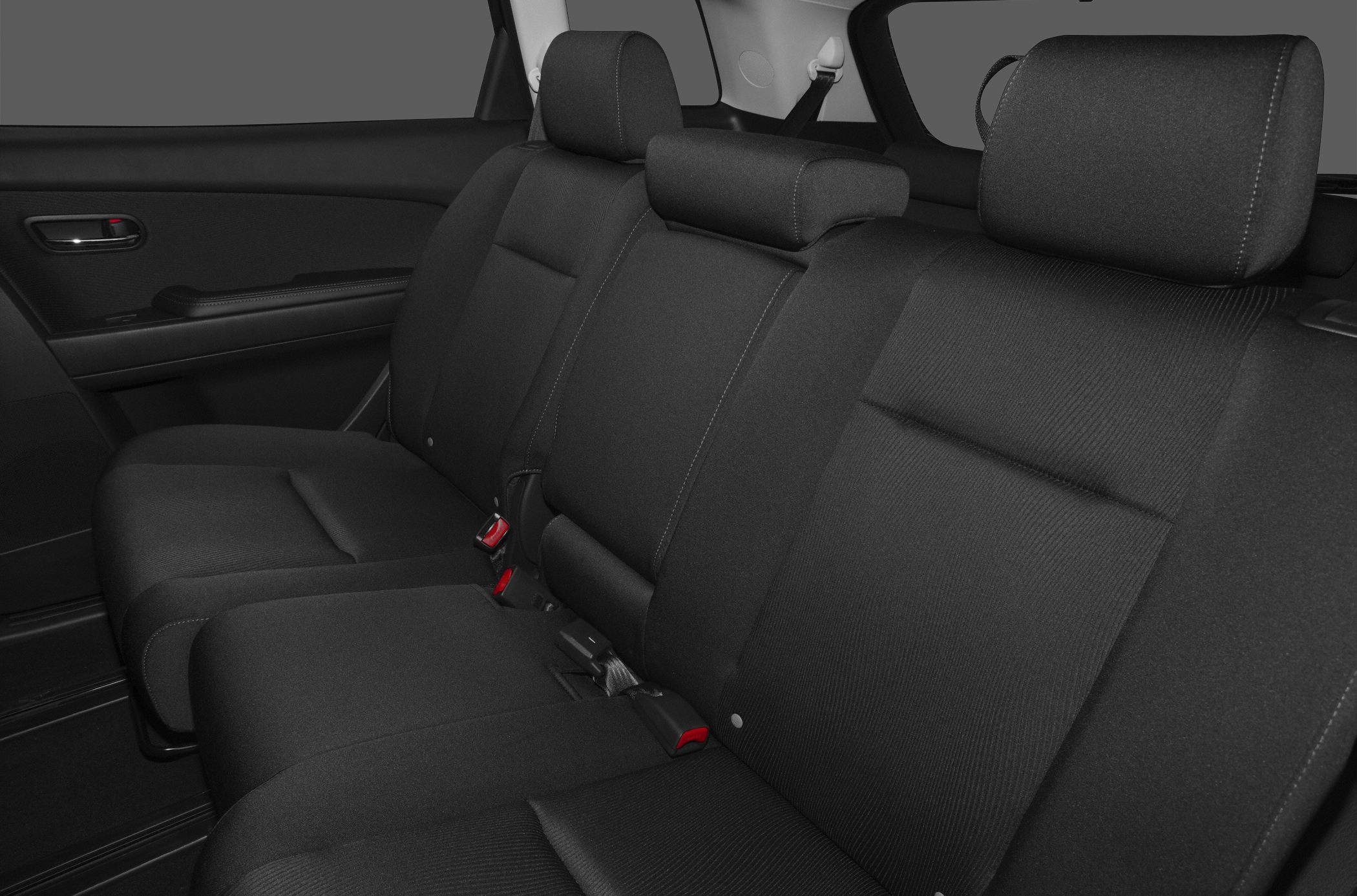 Fabric rear seat interior with seat belts and headrests