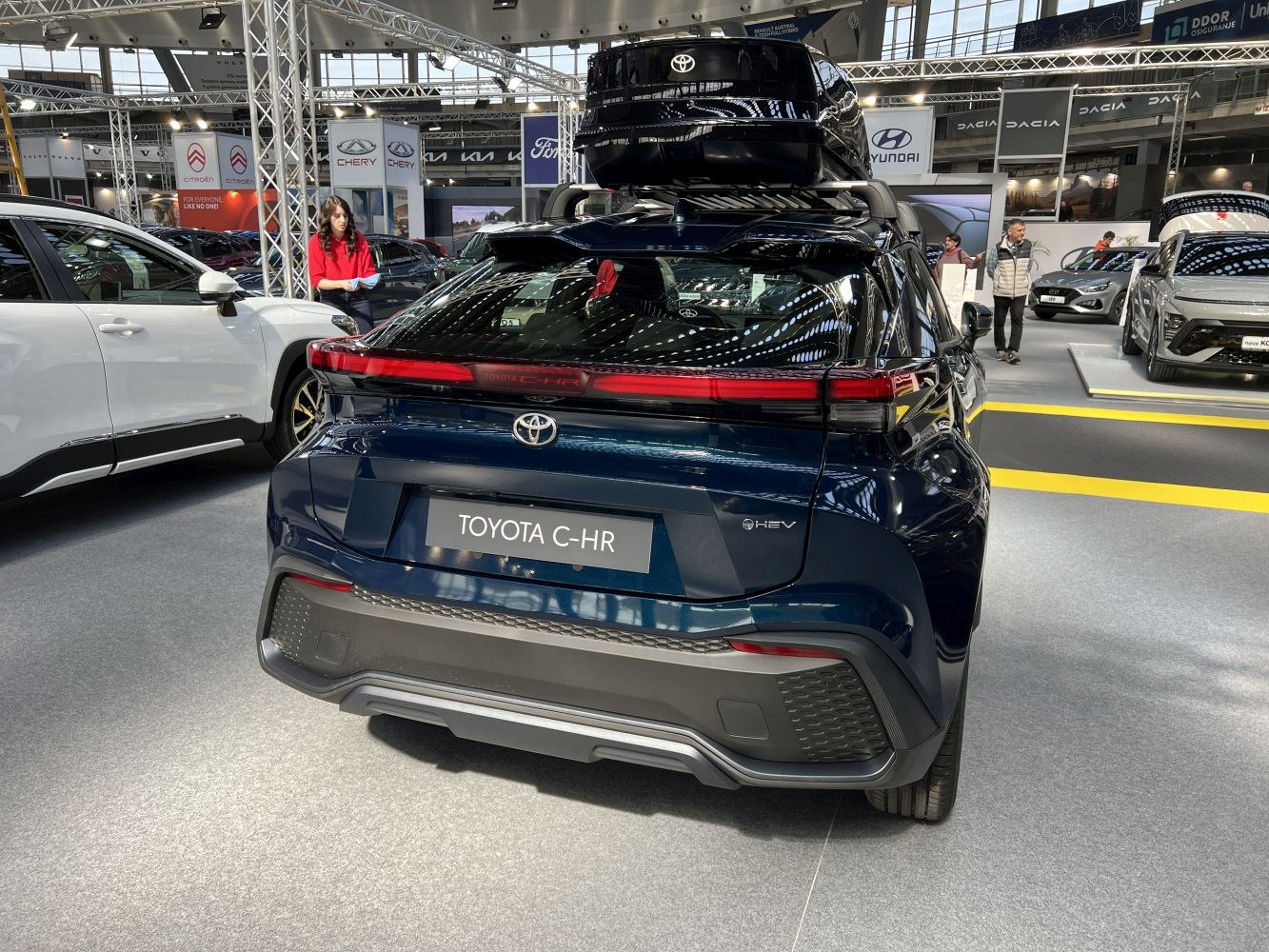 Rear view of SUV with modern taillights and roof storage box