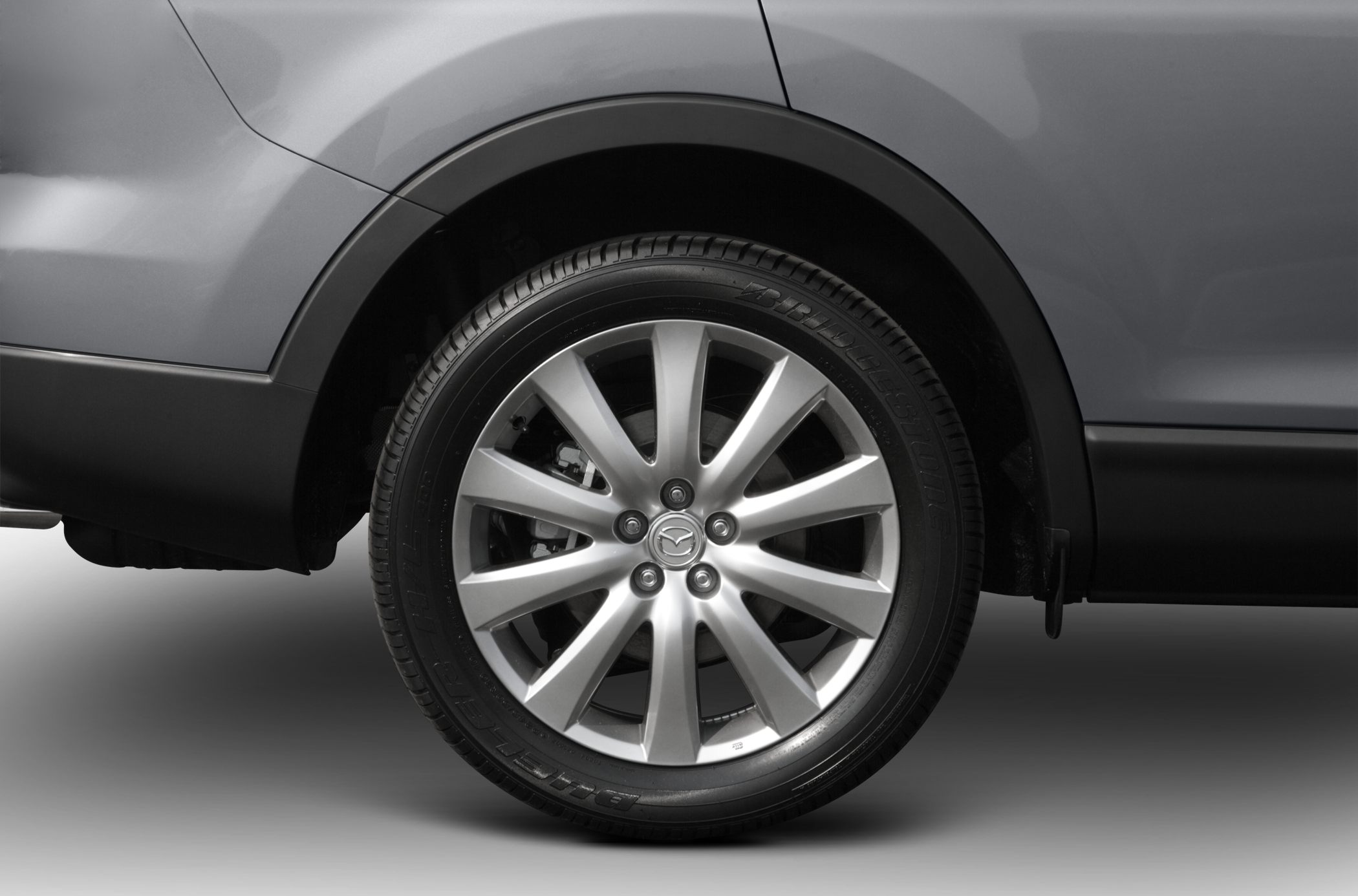 Close-up of alloy wheel with Bridgestone tire and sleek rim design