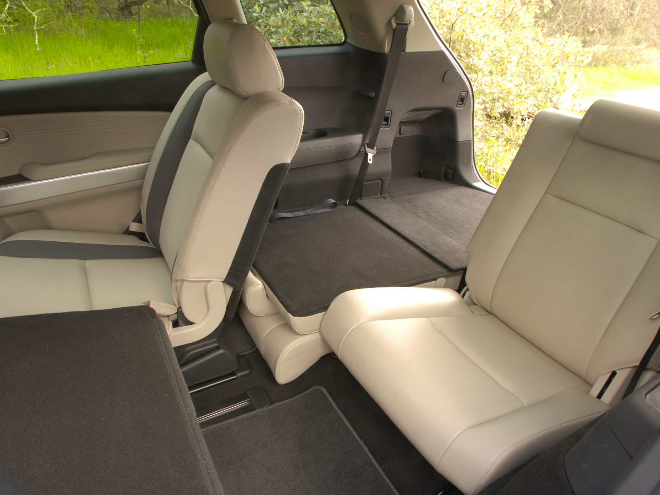 Foldable rear seats and flexible interior seating with leather upholstery