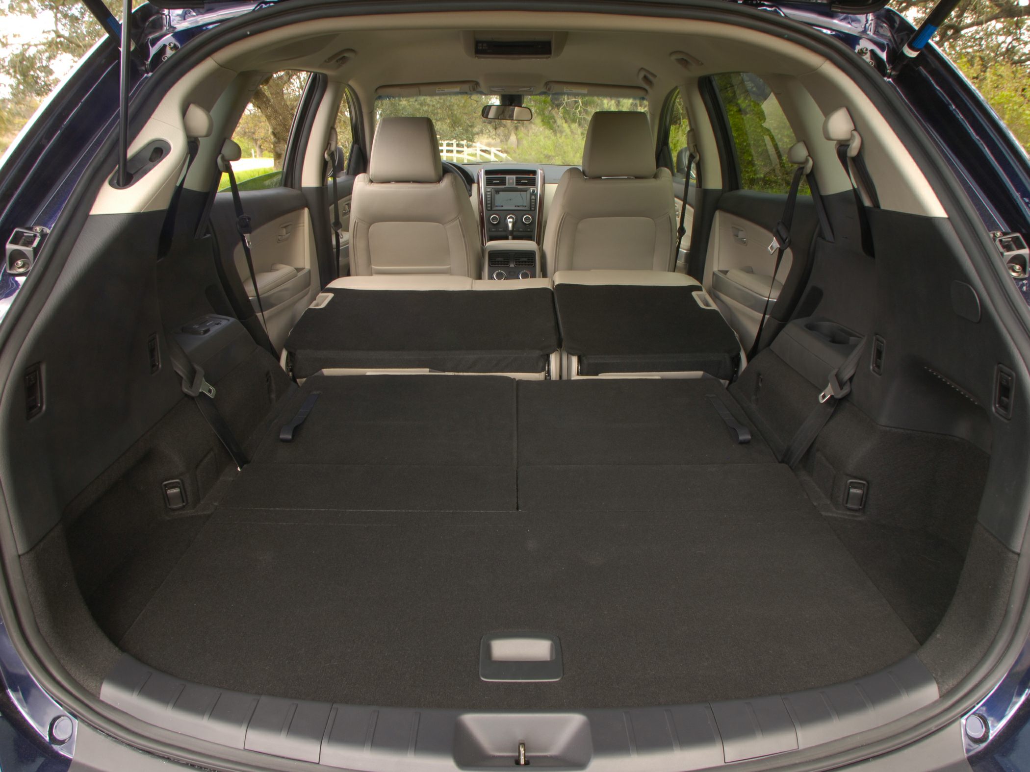 Folded rear seats revealing expanded cargo space and spacious SUV interior.