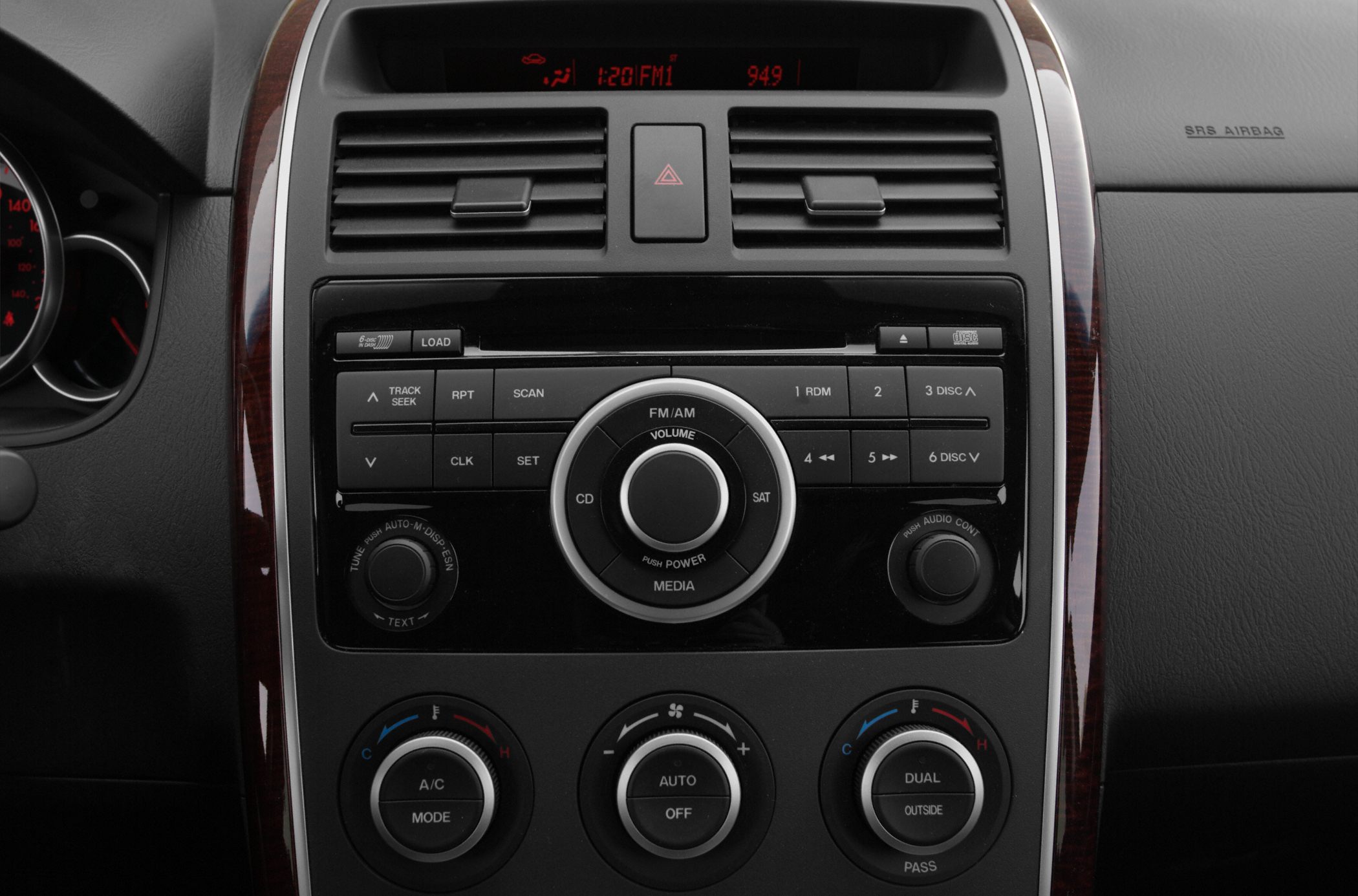 Audio system and climate control center console with knobs and buttons