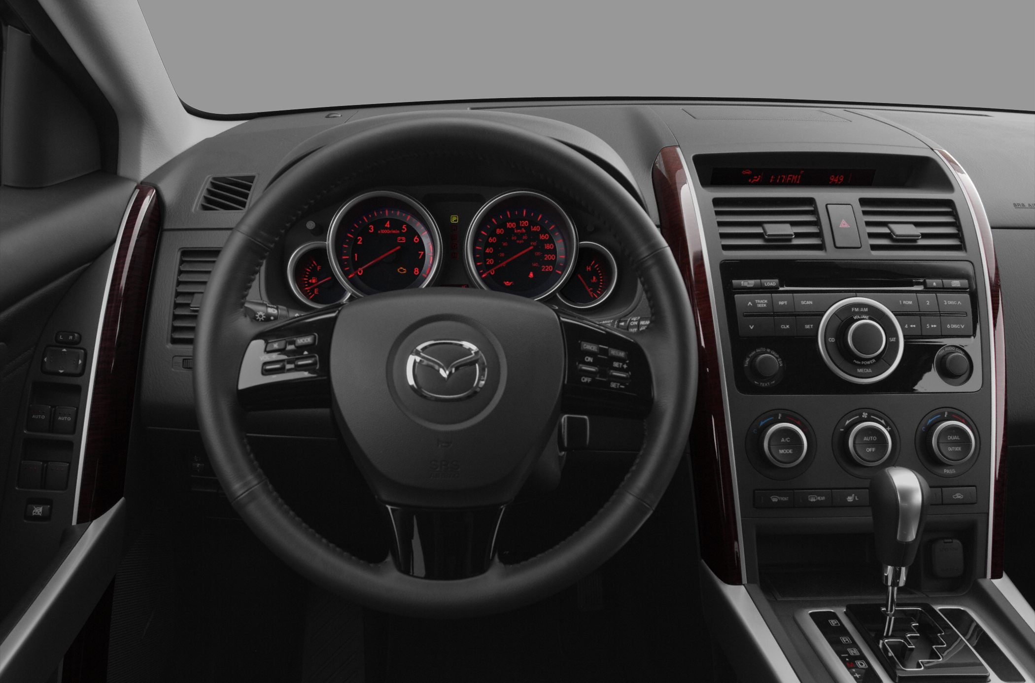 Interior dashboard featuring steering wheel, instrument cluster, and center console controls