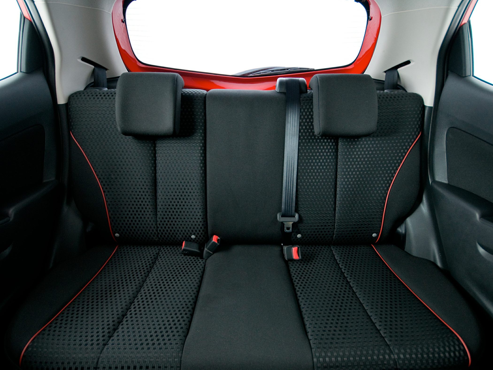 Black fabric rear seats with red piping and headrests