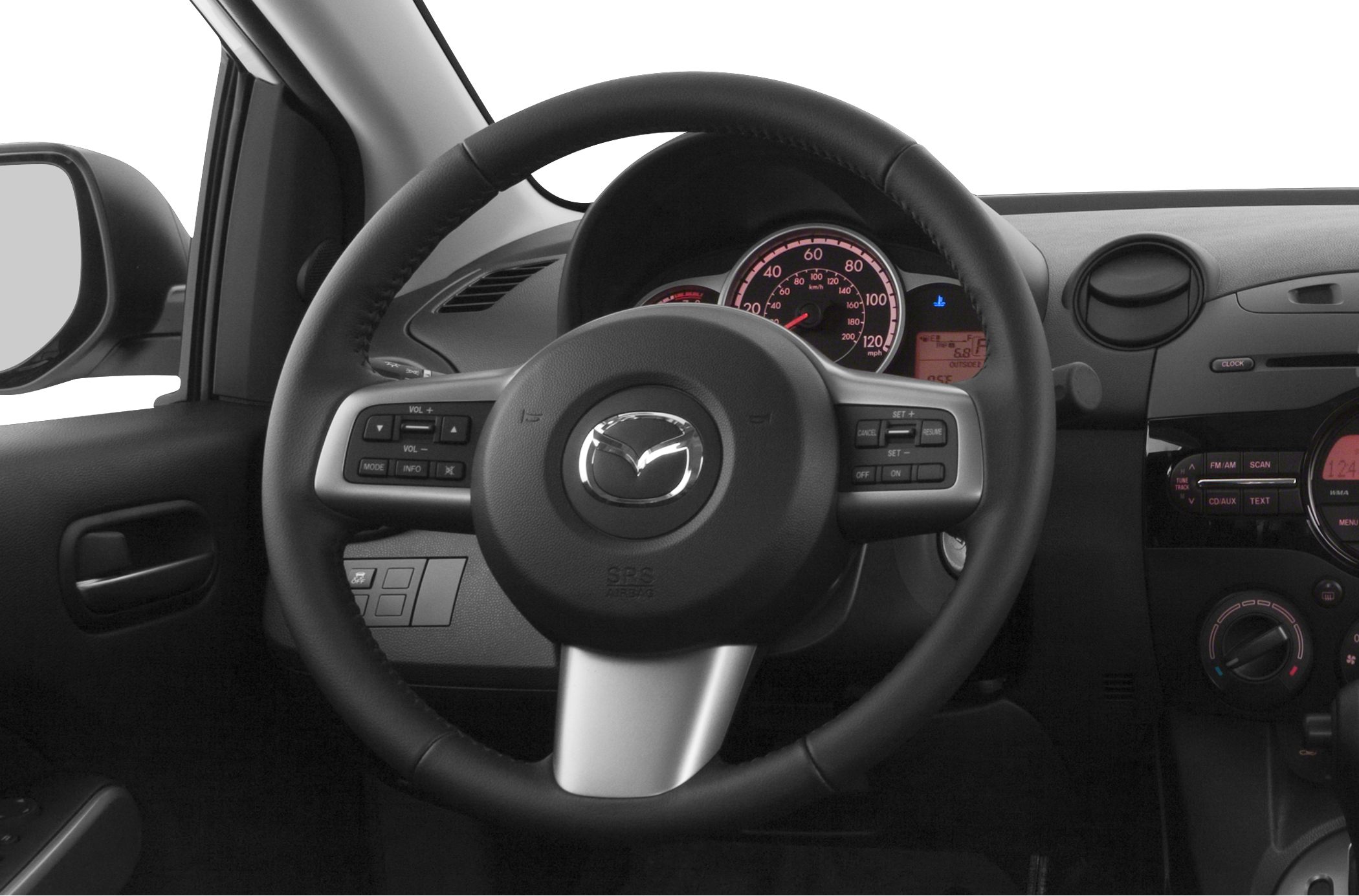 Steering wheel with control buttons, instrument cluster, and dashboard controls