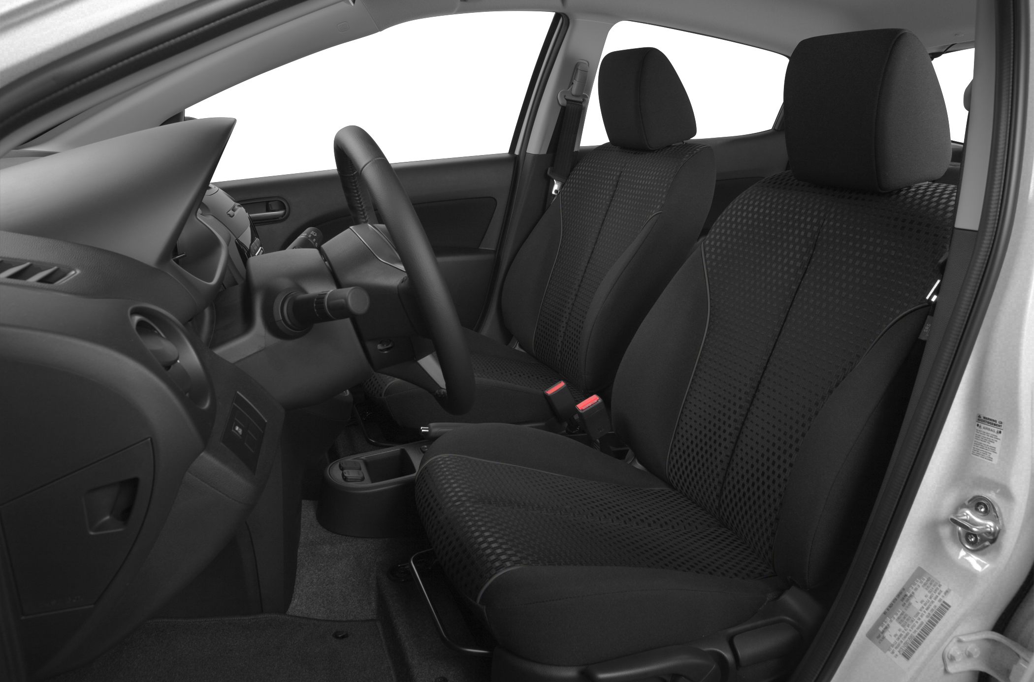 Front seats and dashboard interior with fabric upholstery and steering wheel