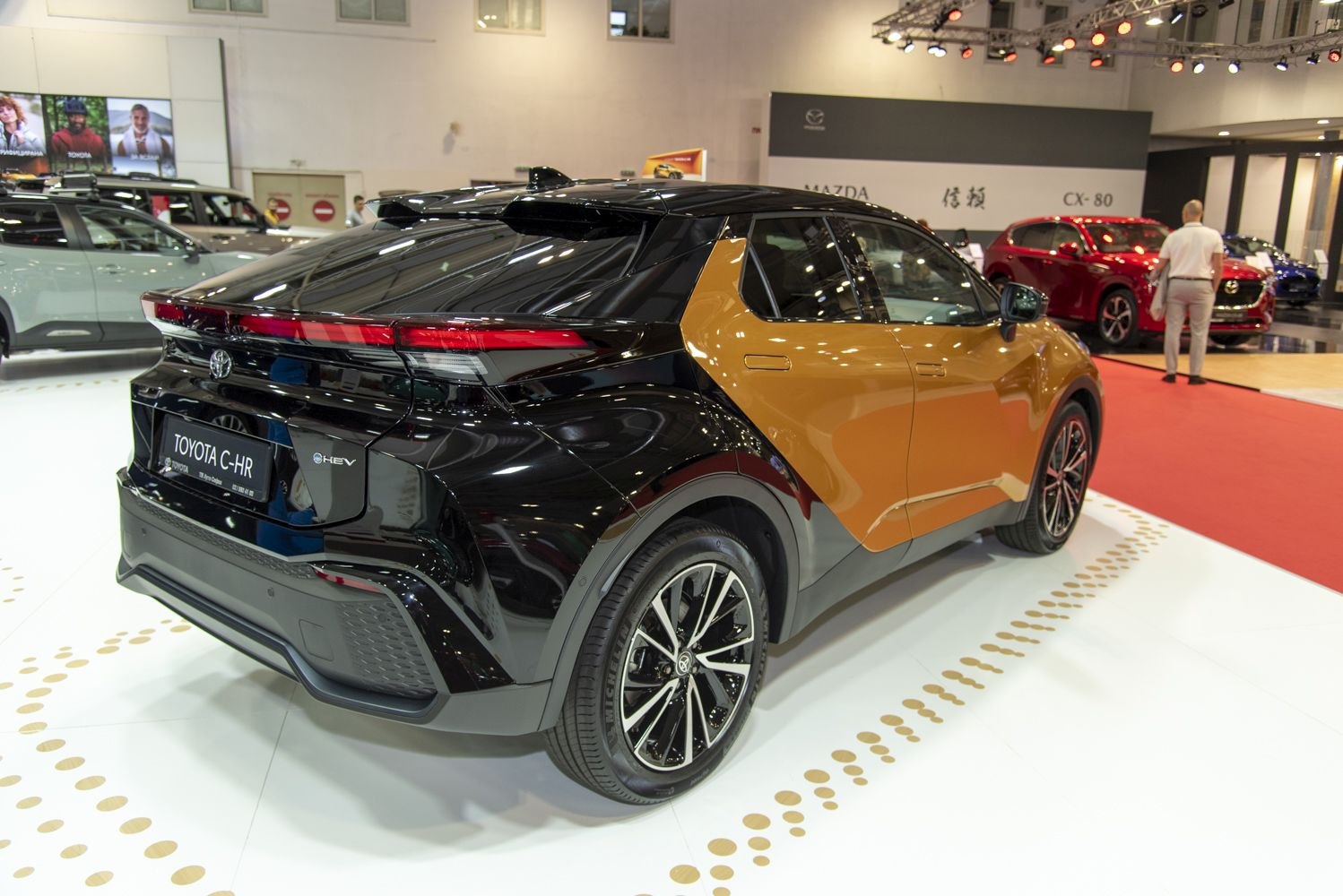 Rear side of a two-tone SUV with modern taillights and alloy wheels