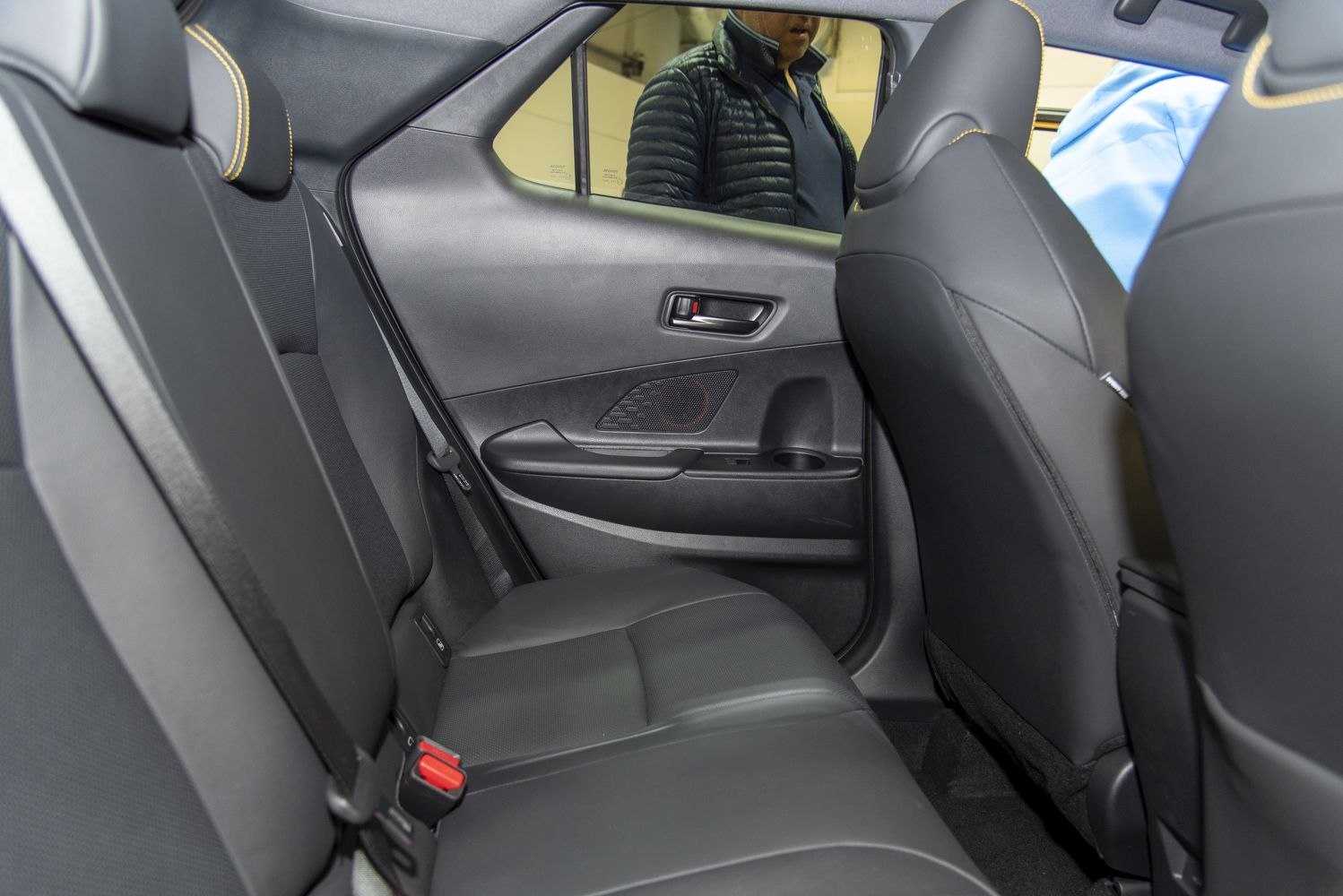 Black rear passenger seat with upholstery and door panel details