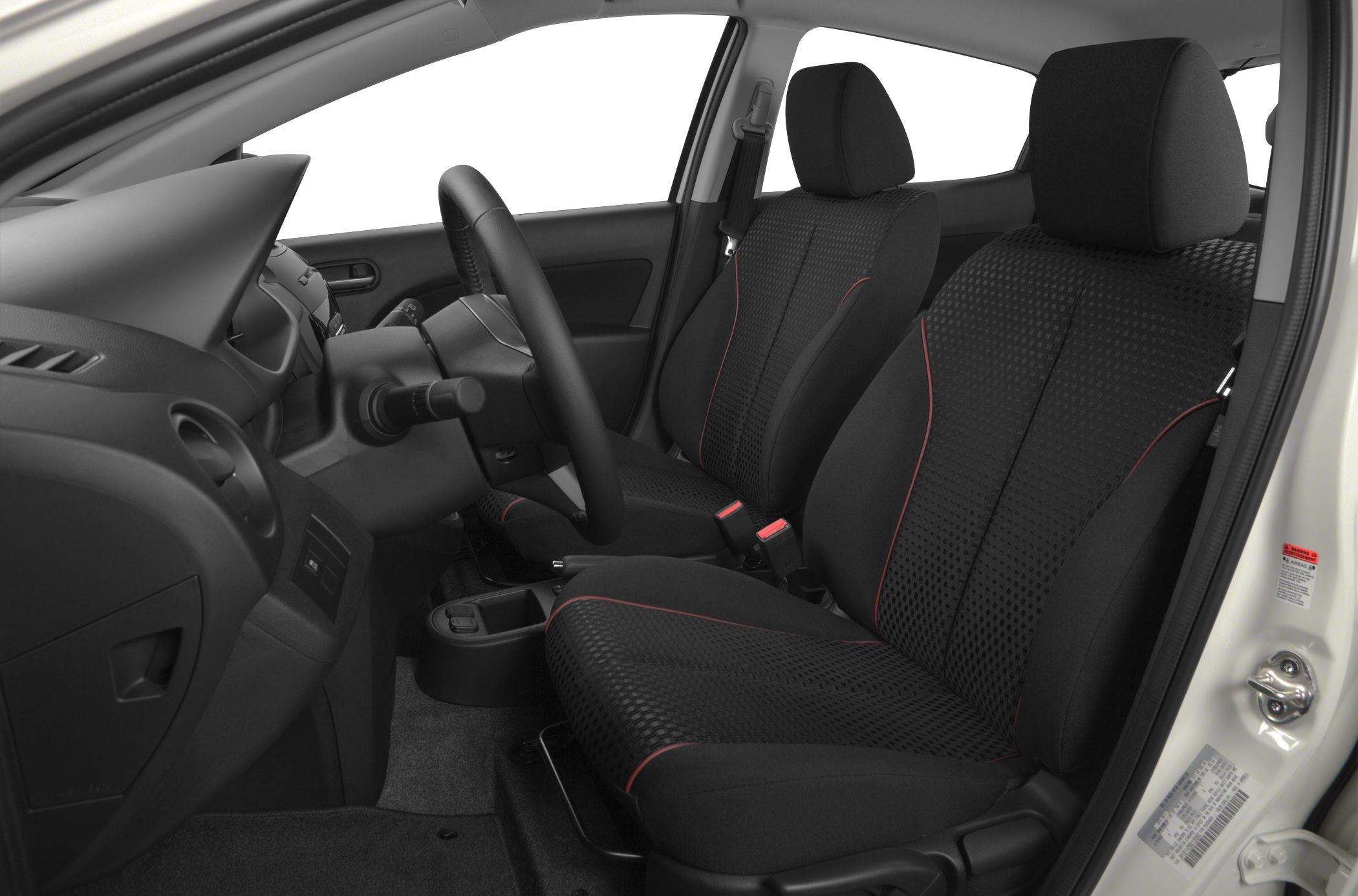 Front seats and dashboard interior view with black fabric upholstery and red accents