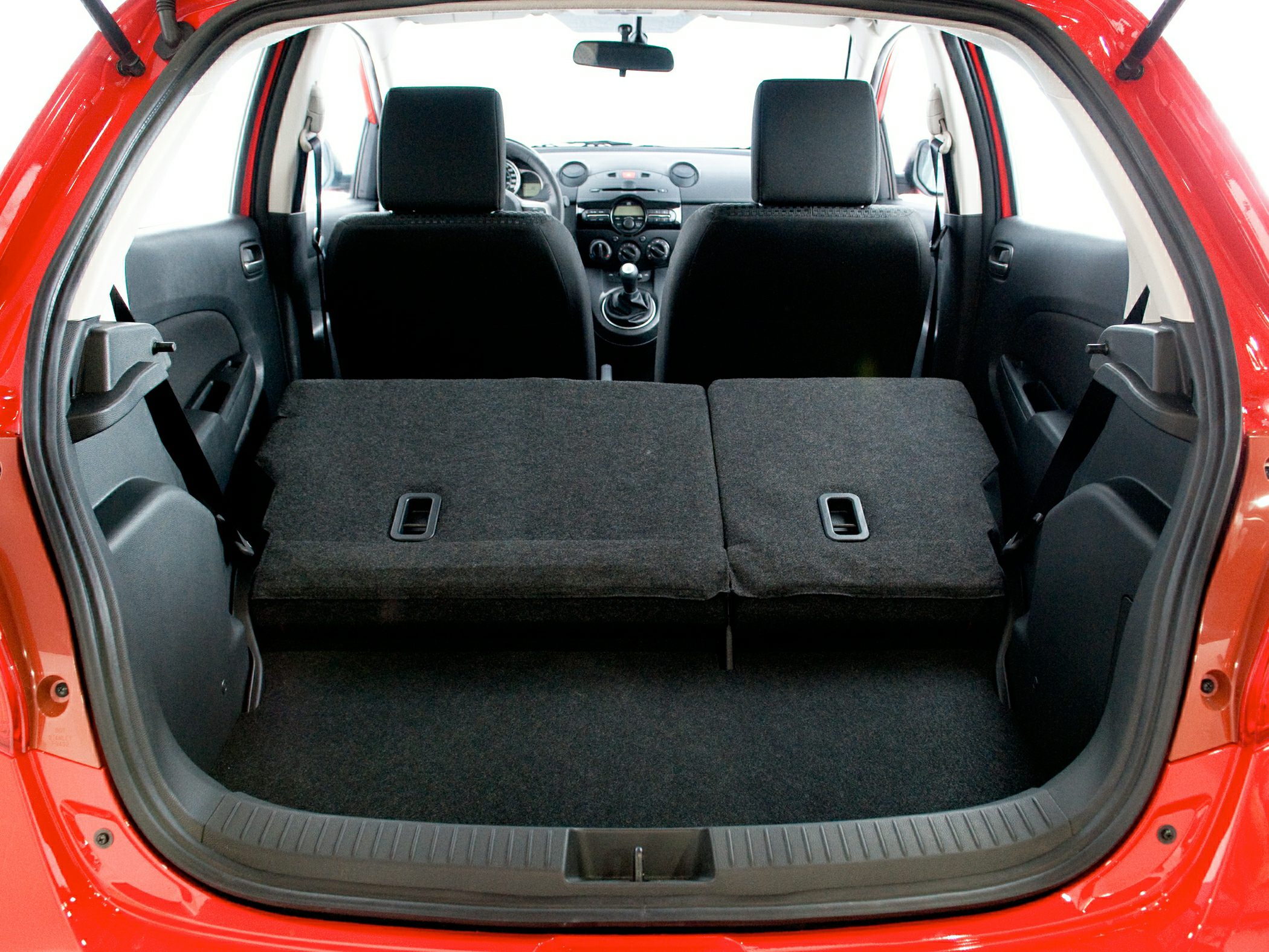 Folded rear seats with spacious trunk interior showing hatchback storage setup