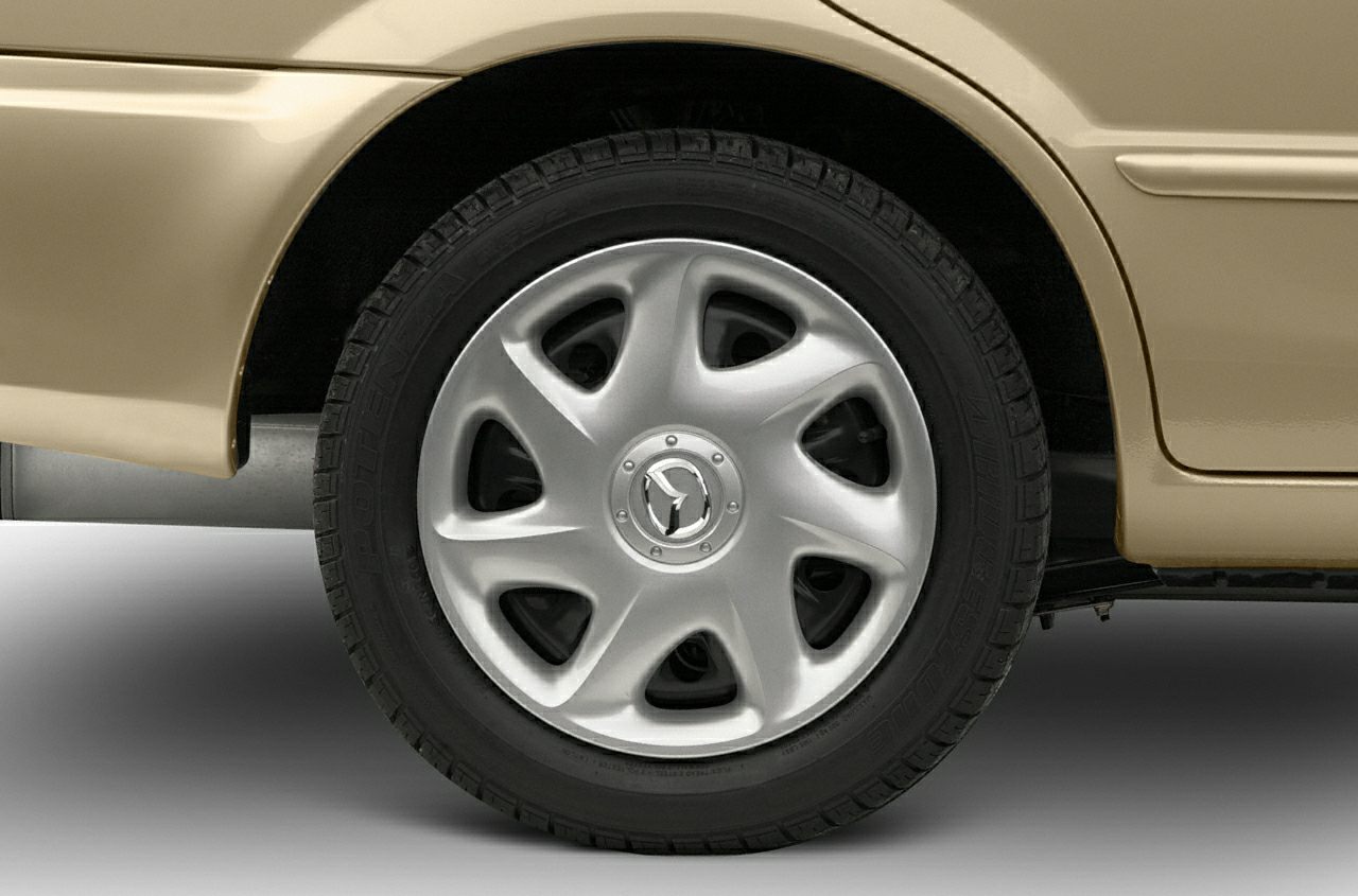 Six-spoke alloy wheel with Mazda emblem and tire tread detail