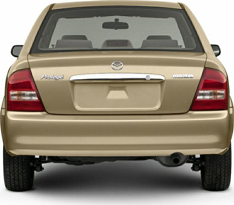 Rear view of sedan with tail lights and chrome trunk handle