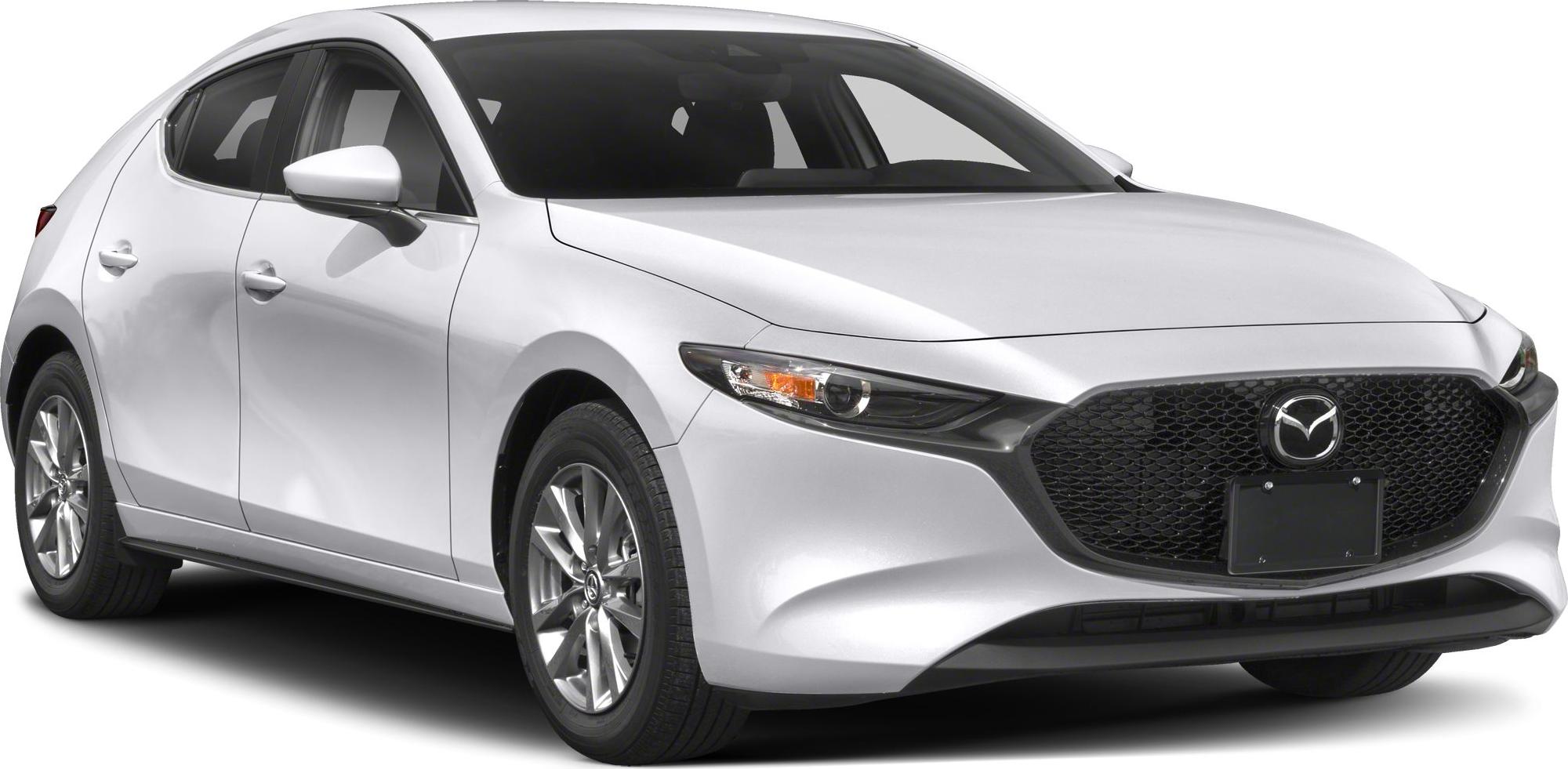Front-side view with large black mesh grille and sharp headlights