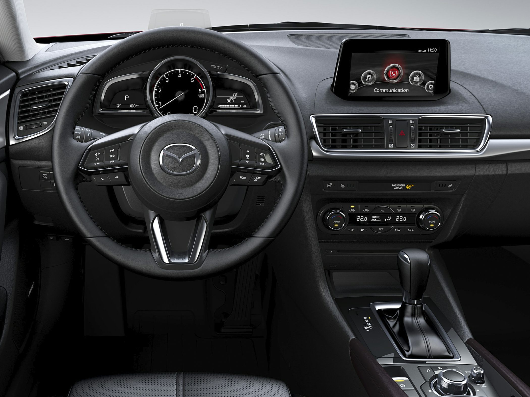 Dashboard, steering wheel with controls, infotainment screen, and automatic gear lever