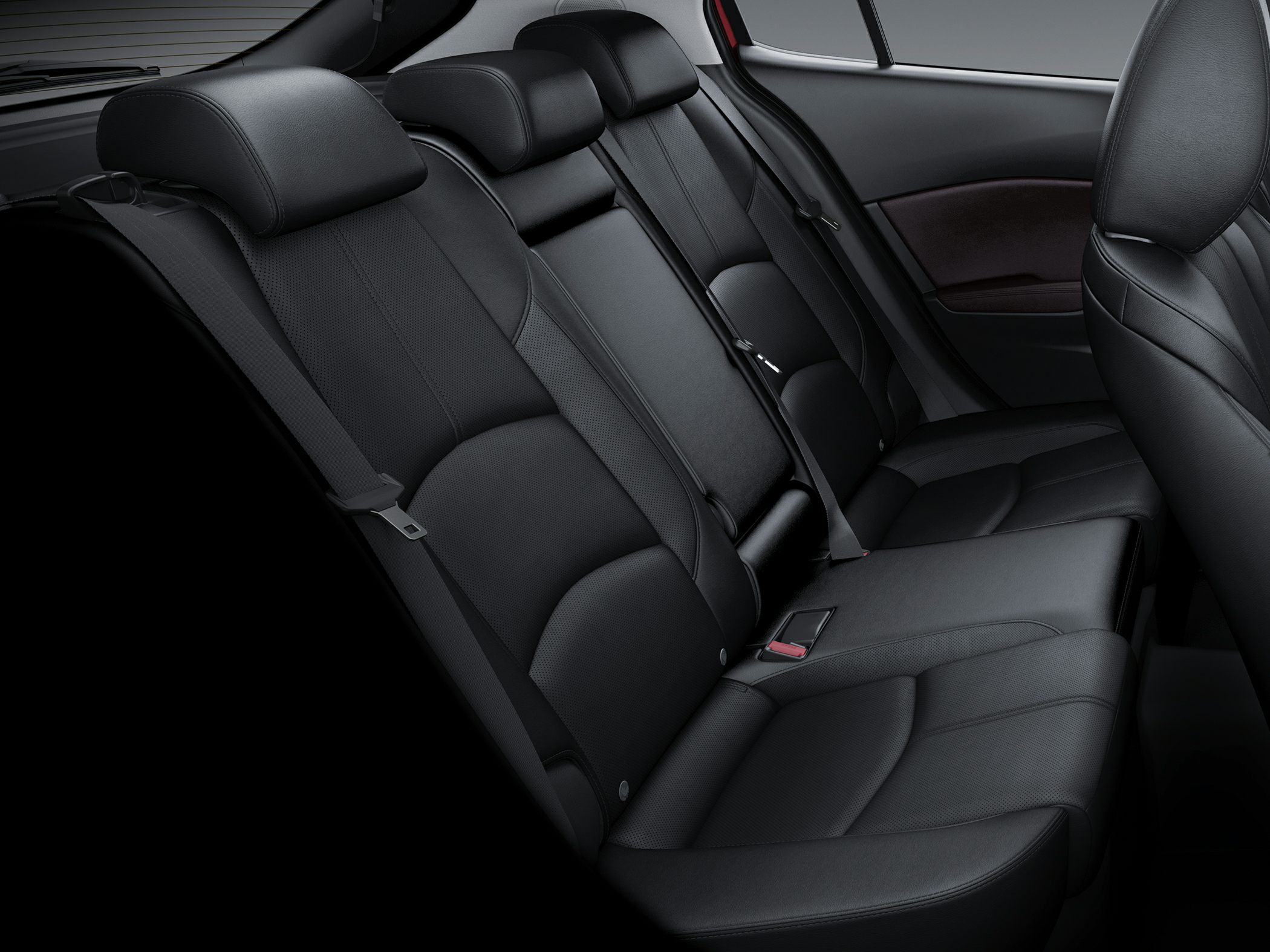 Black leather rear seats with ergonomic design and integrated headrests