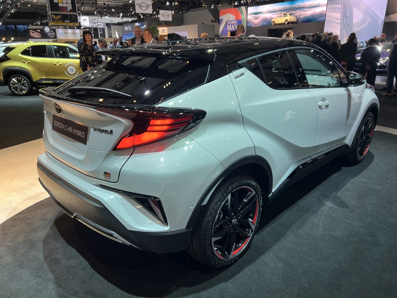 Rear and side view of hybrid compact SUV with sleek lights, sporty wheels