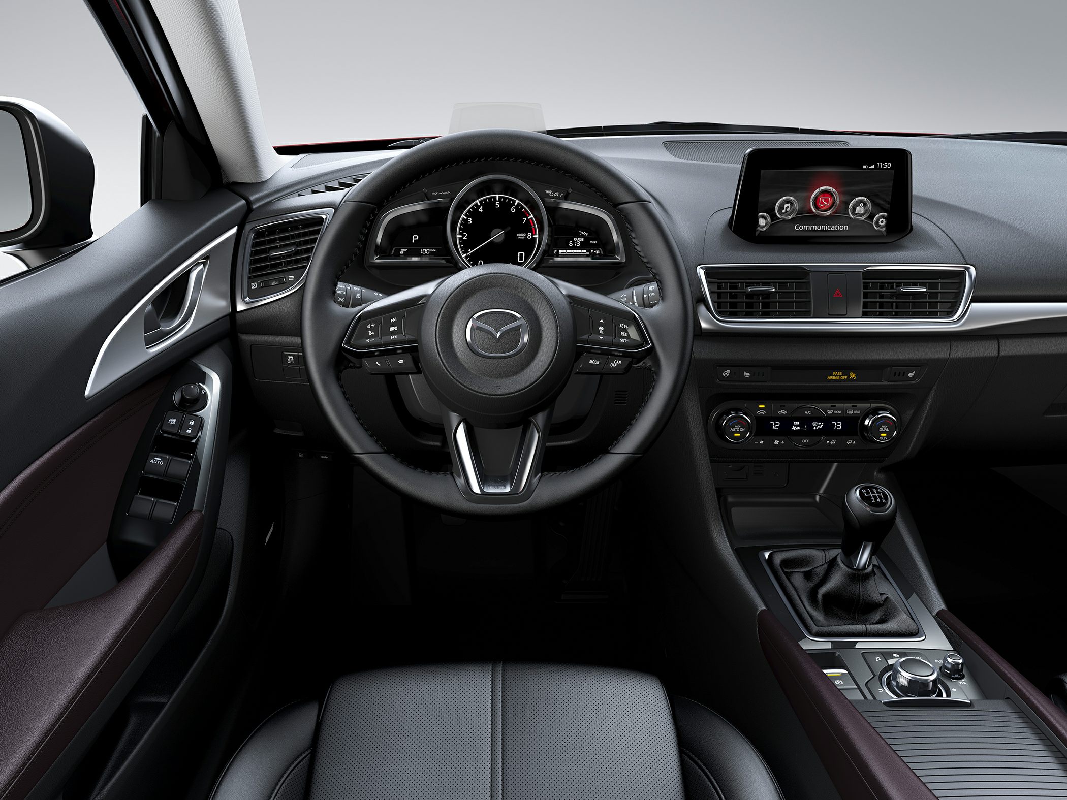 Dashboard with steering wheel, instrument cluster, infotainment screen, and manual gearshift