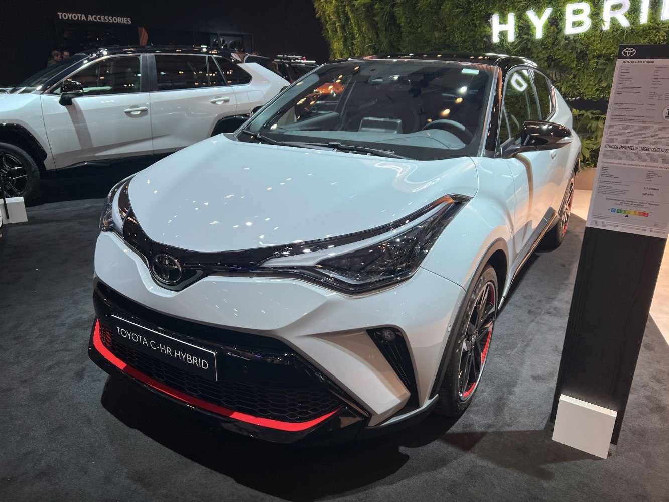 Front view with sharp headlights and sporty grille